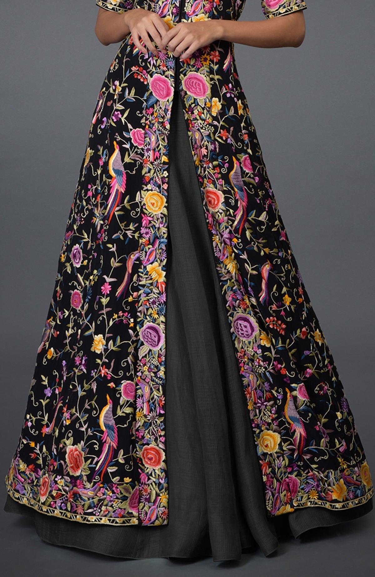 Black flared jacket with multicolor Parsi Gara embroidery paired with elephant grey skirt