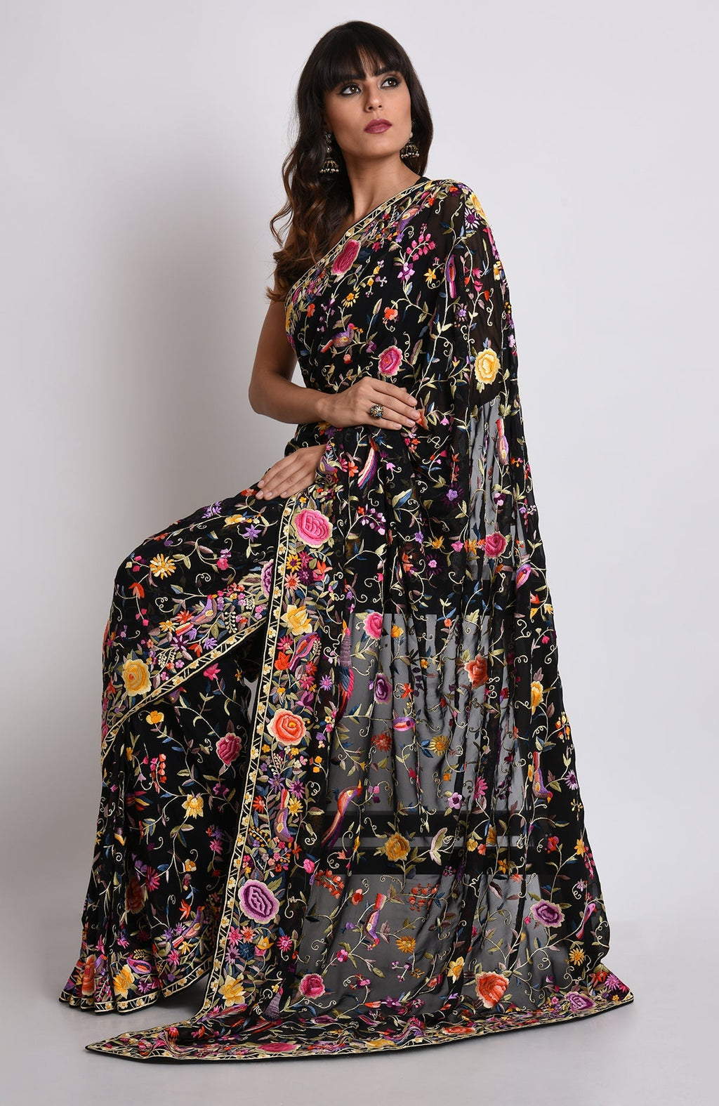 Black Parsi Gara hand-embroidered saree with colorful floral and bird motifs.