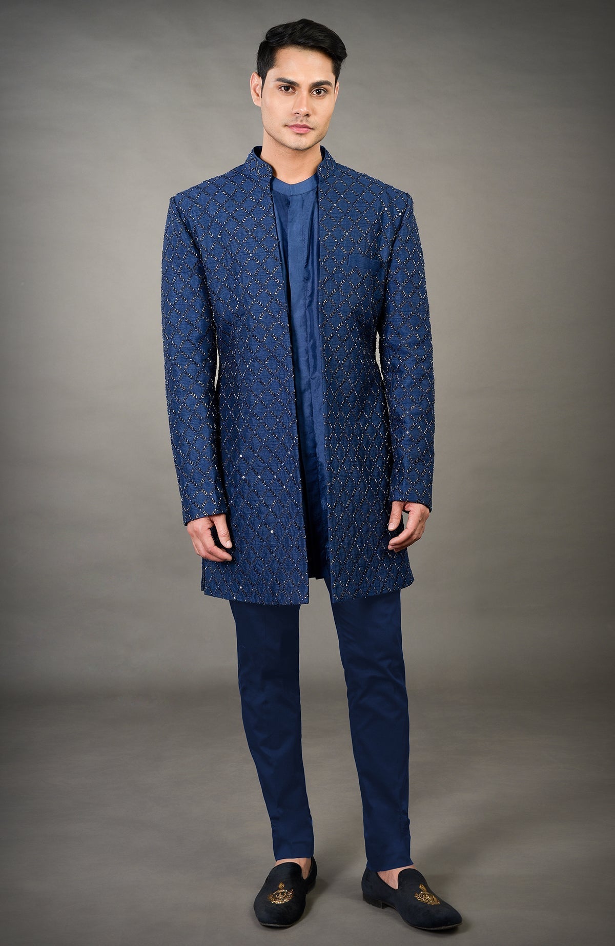 Navy blue chikankari embellished jacket set with a matching kurta and pants.