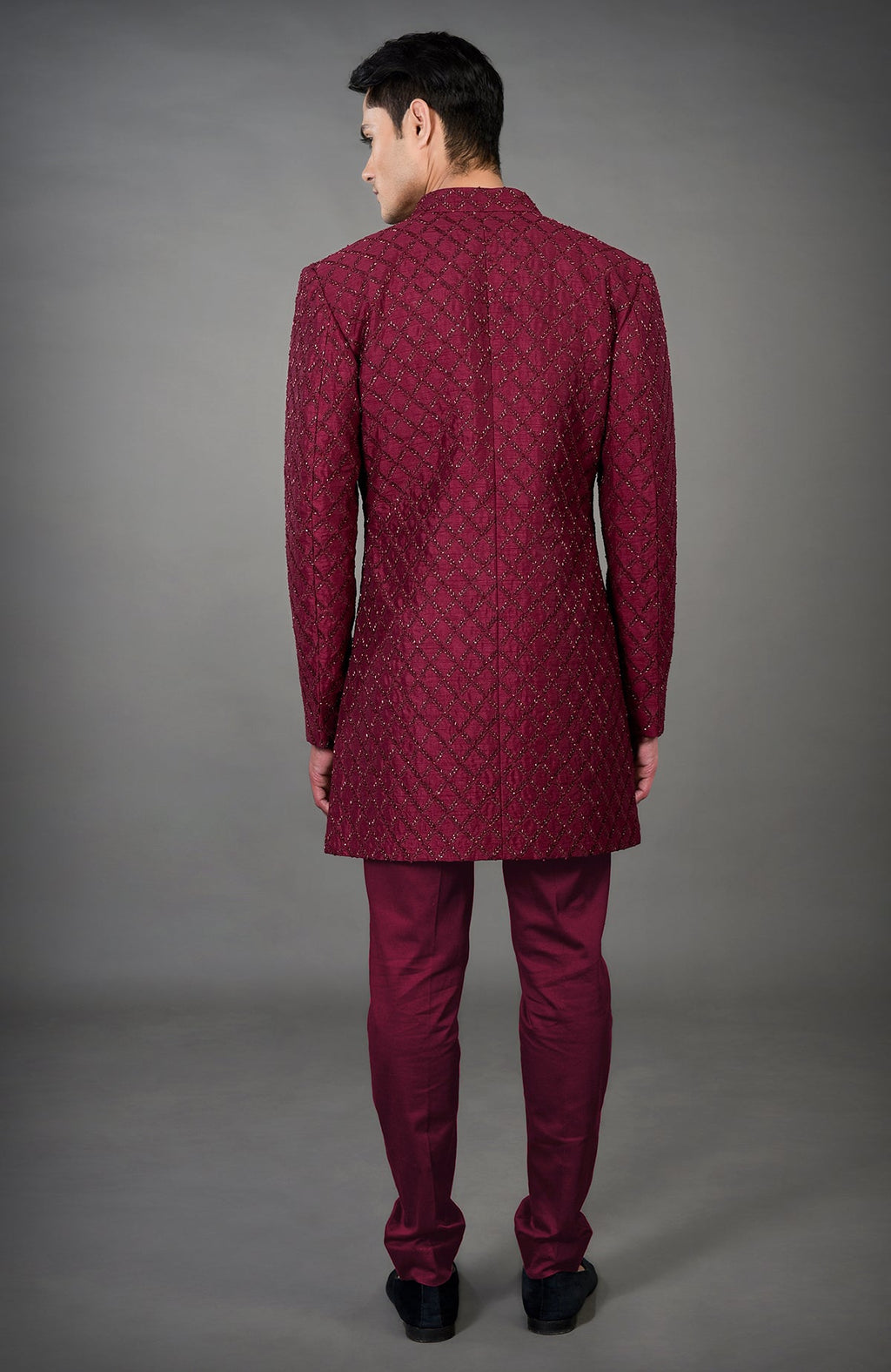 Maroon chikankari embellished jacket set with matching pants, viewed from the back.