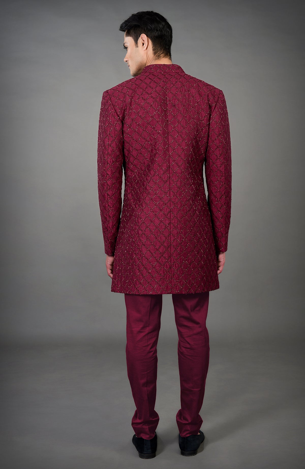 Maroon chikankari embellished jacket set with matching pants, viewed from the back.