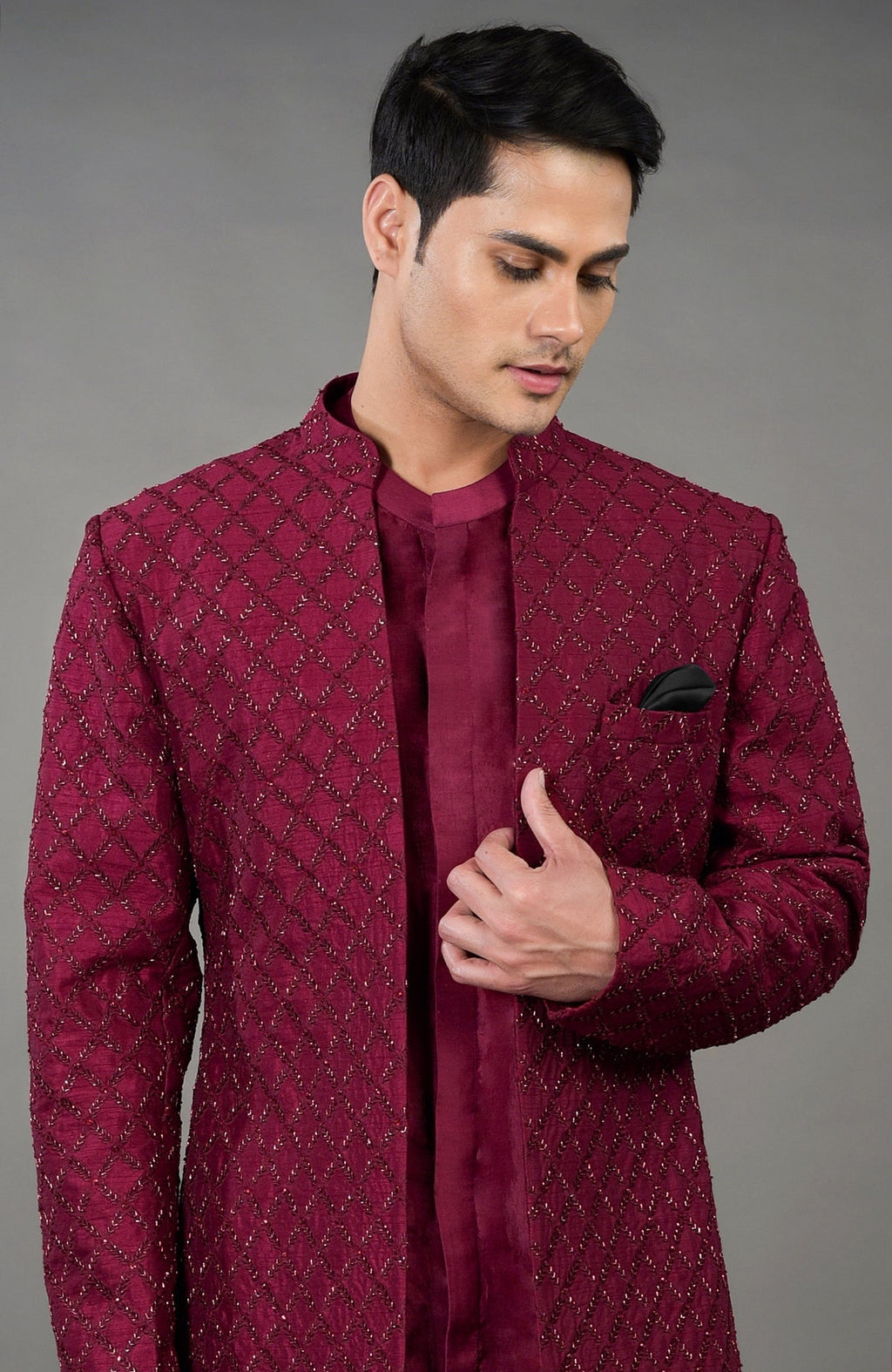 Maroon chikankari embellished jacket set with a band collar and black pocket square.