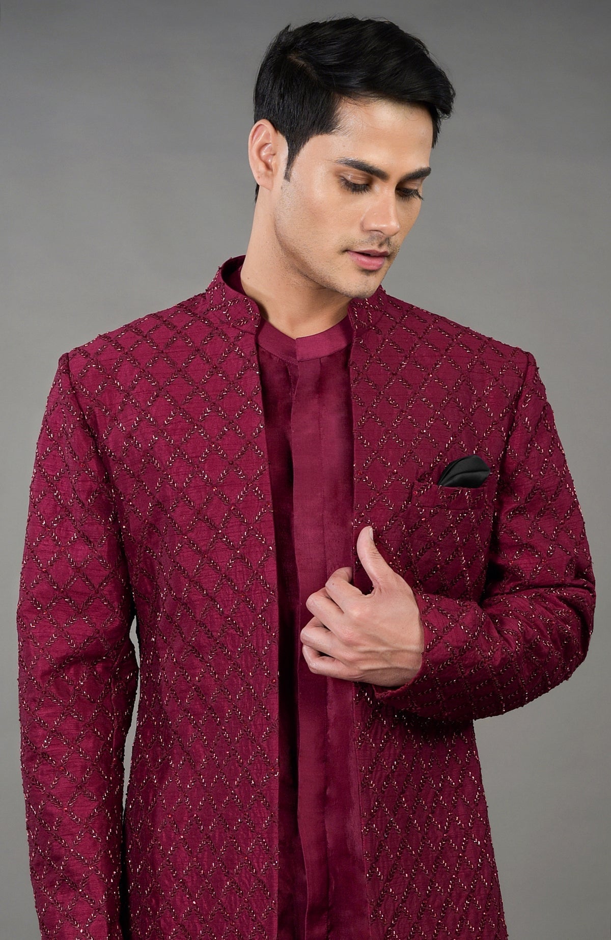 Maroon chikankari embellished jacket set with a band collar and black pocket square.