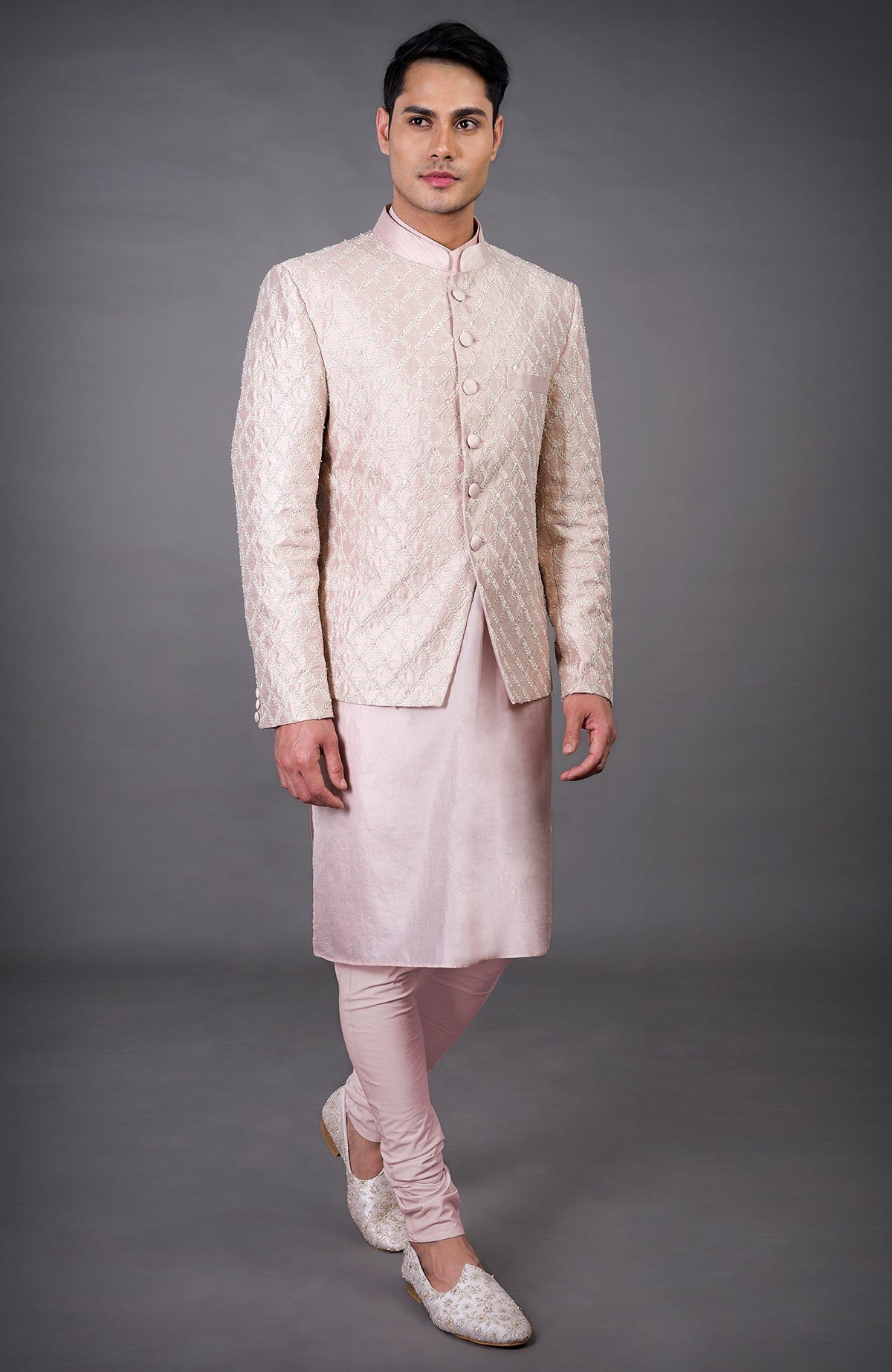 Barely pink chikankari embellished bandhgala set with matching kurta and pants.