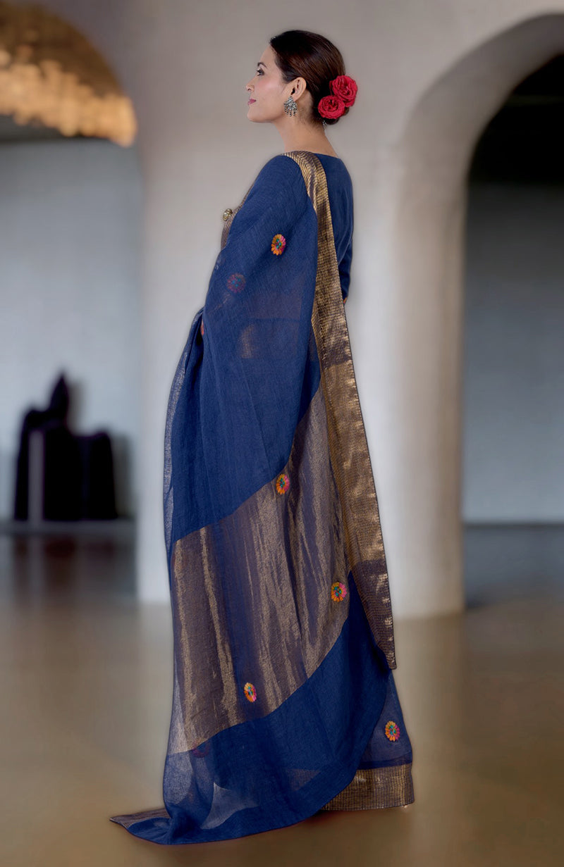 Navy blue linen saree with Kashidakari embroidery and gold zari border.