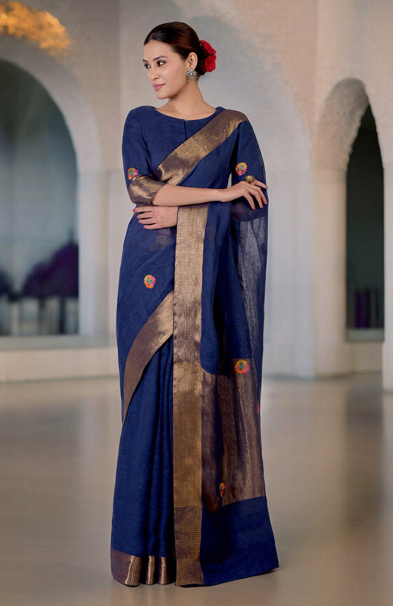 Navy blue linen saree with Kashidakari embroidery and gold zari border.