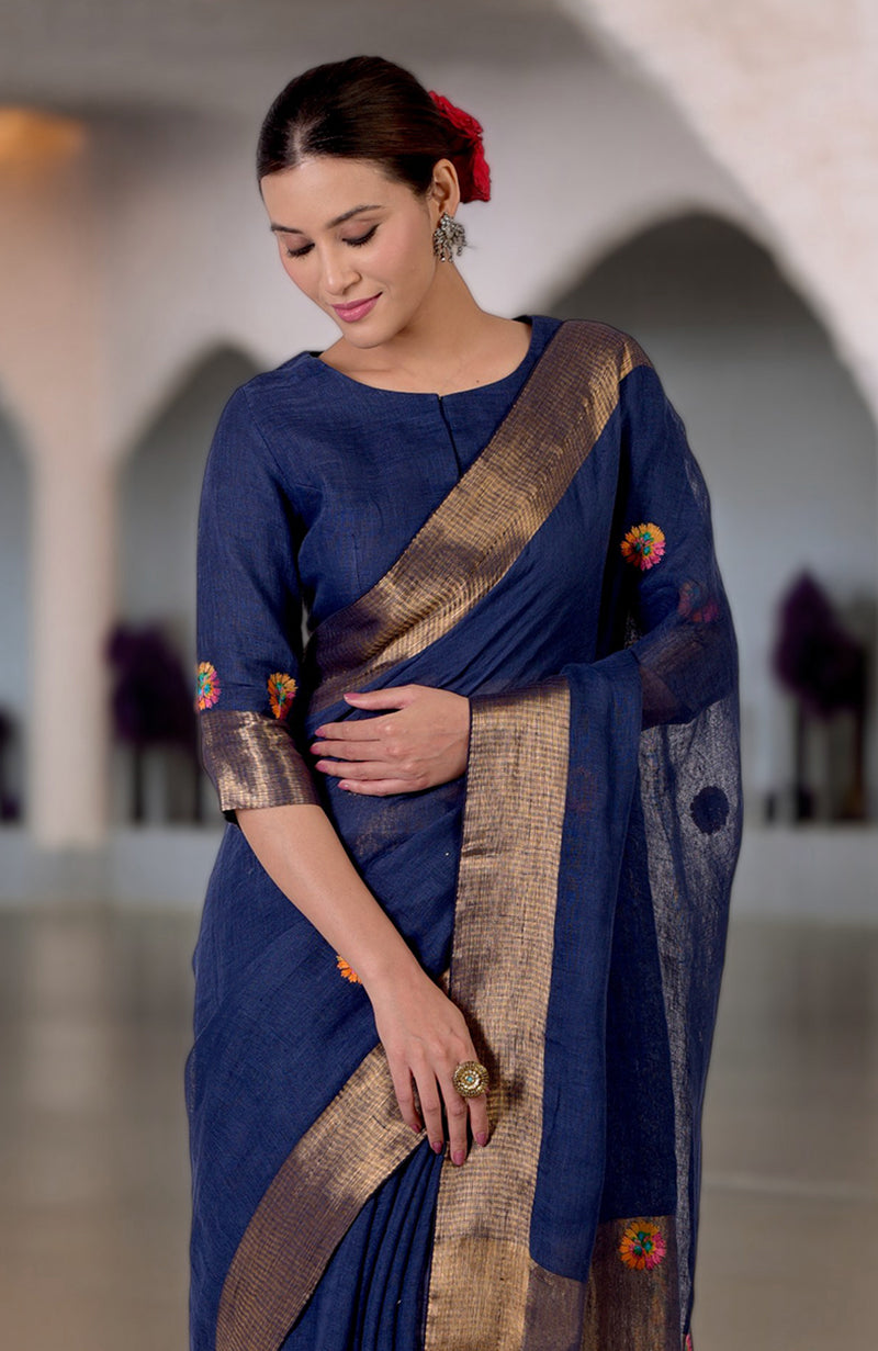 Navy blue linen saree with Kashidakari embroidery and gold zari border.