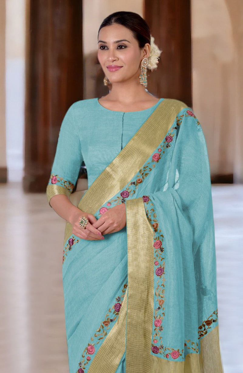 Antigua Sand Parsi Gara embroidered linen saree with a boat neck blouse.
