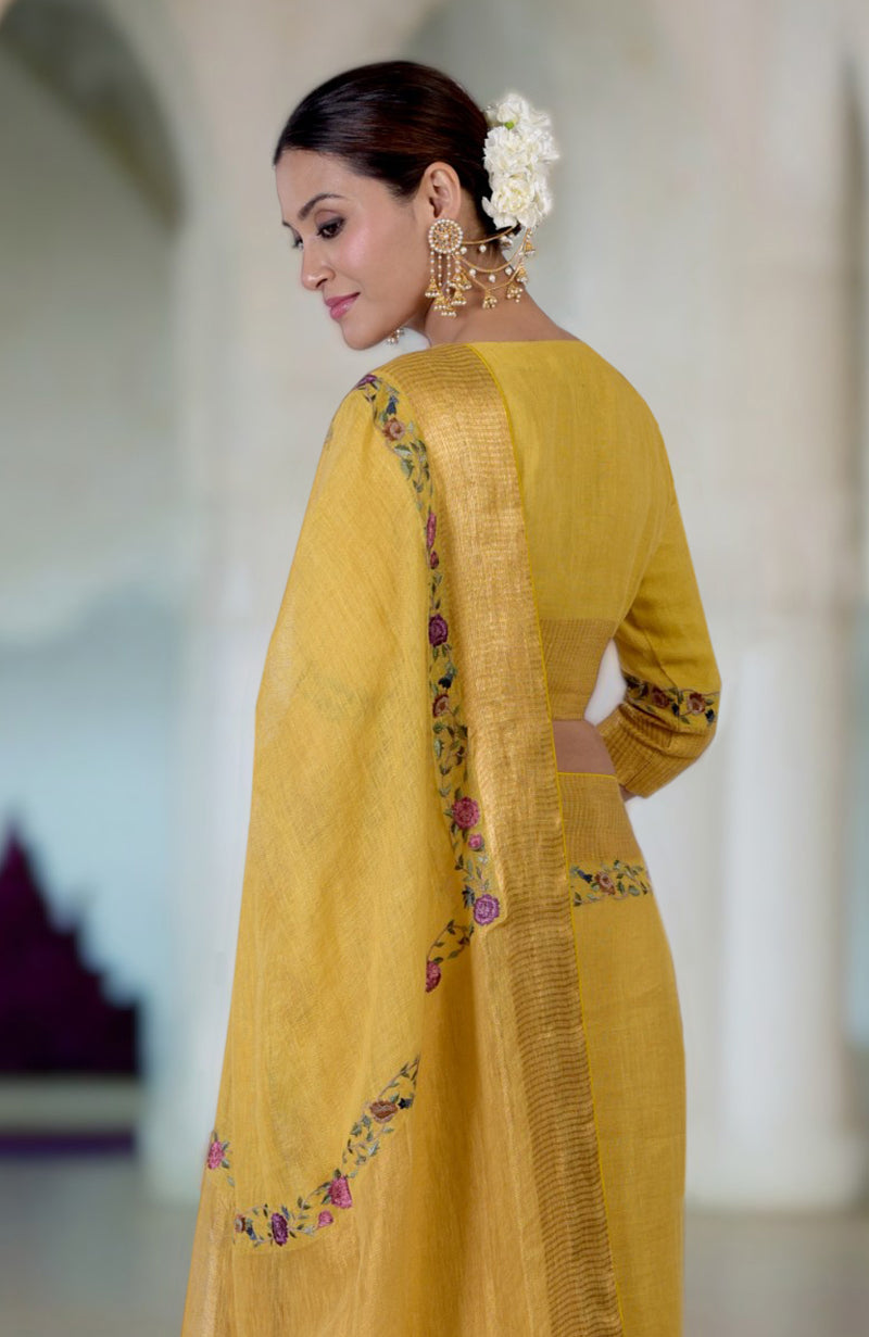 Calendula yellow linen saree with Parsi Gara embroidery and zari details.