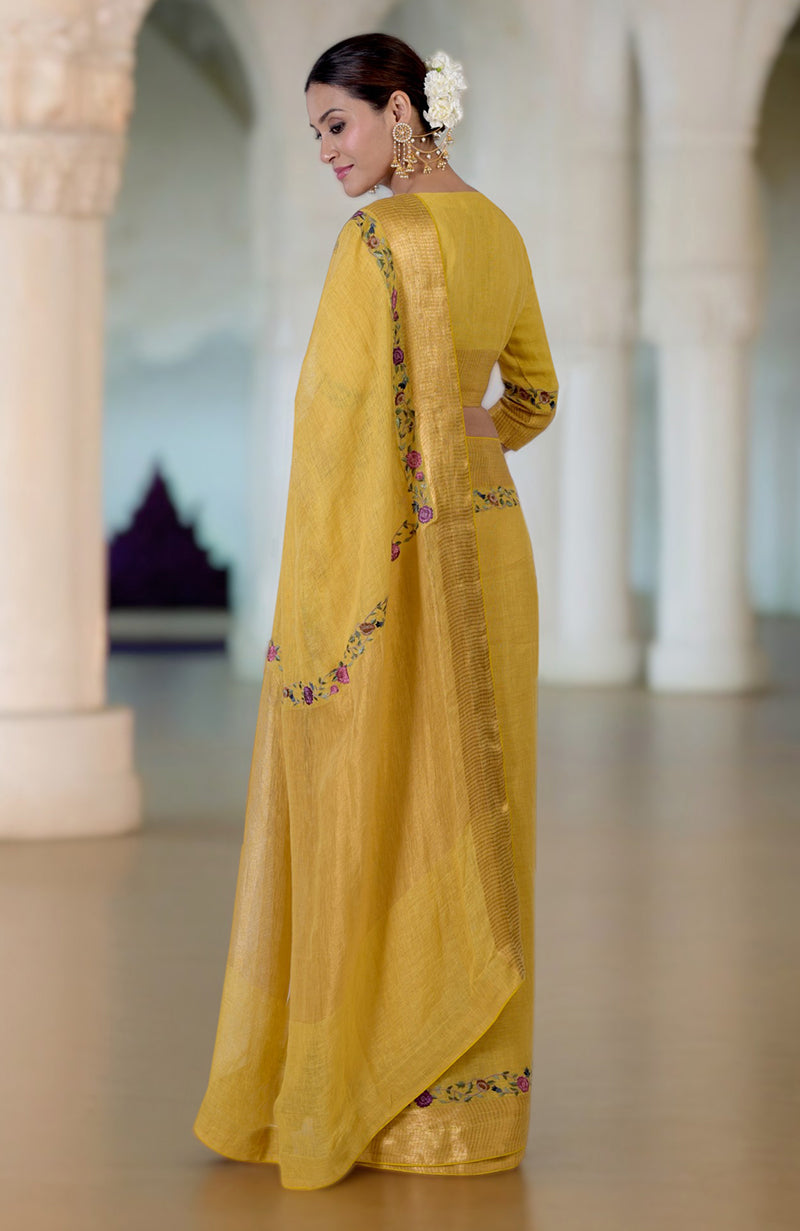 Calendula yellow linen saree with Parsi Gara embroidery and zari details.