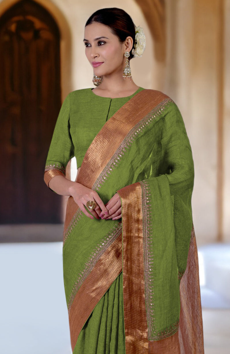 Kelp Forest green linen saree with gold marori embroidered borders.