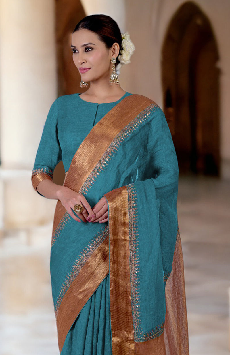 Mosaic Blue Marori Embroidered Linen Saree with a gold border and matching blouse.