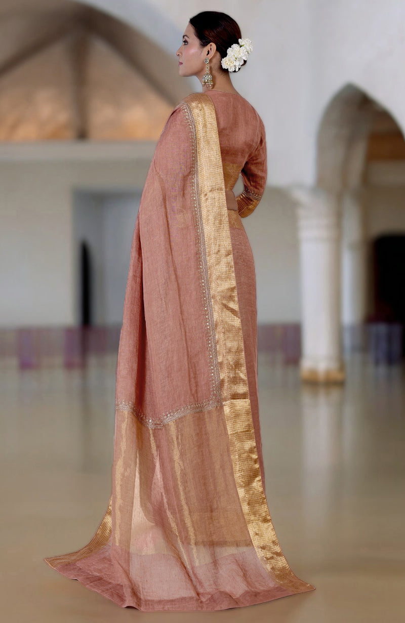 Chutney marori embroidered linen saree with a gold border and matching blouse.