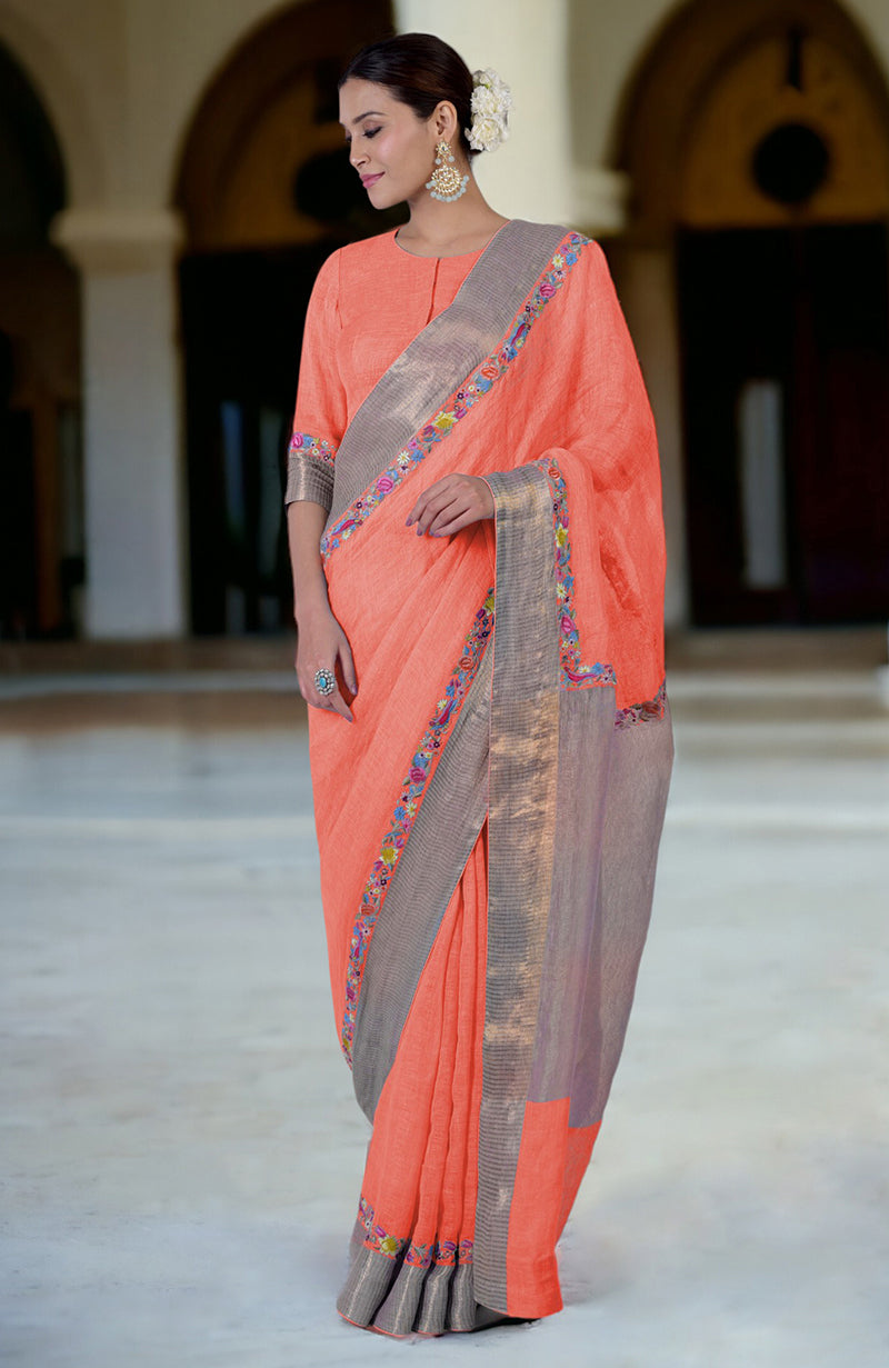 Living coral linen saree with Parsi Gara embroidery and zari details.