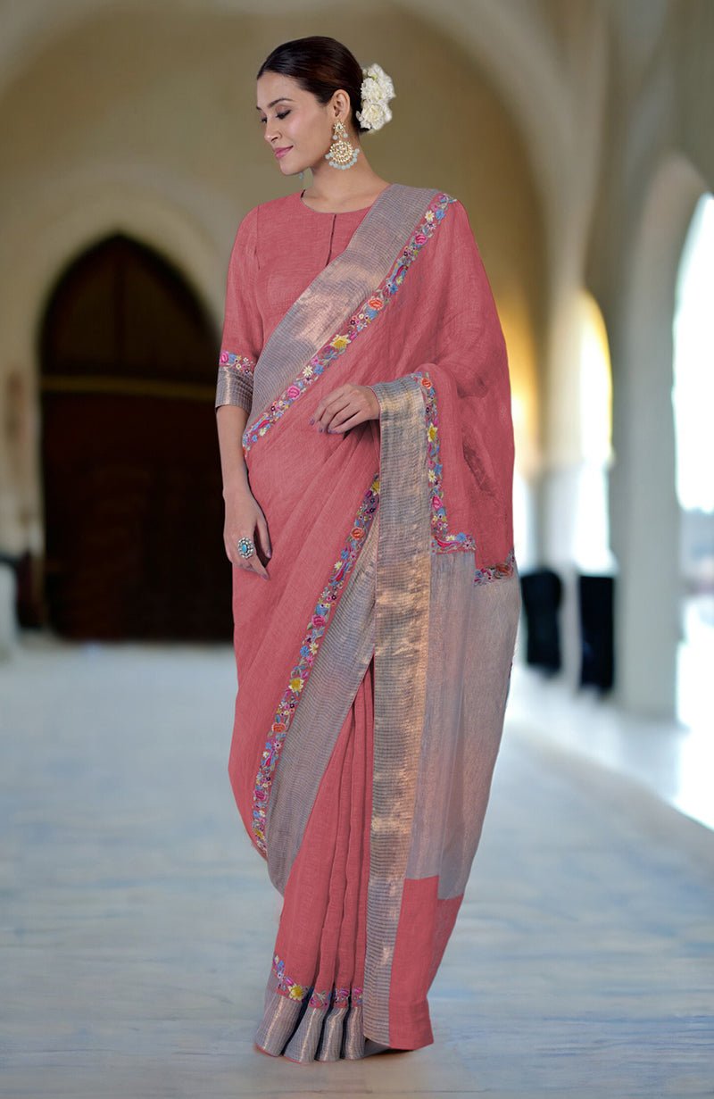 A woman models a Desert Rose Parsi Gara embroidered linen saree with zari details.