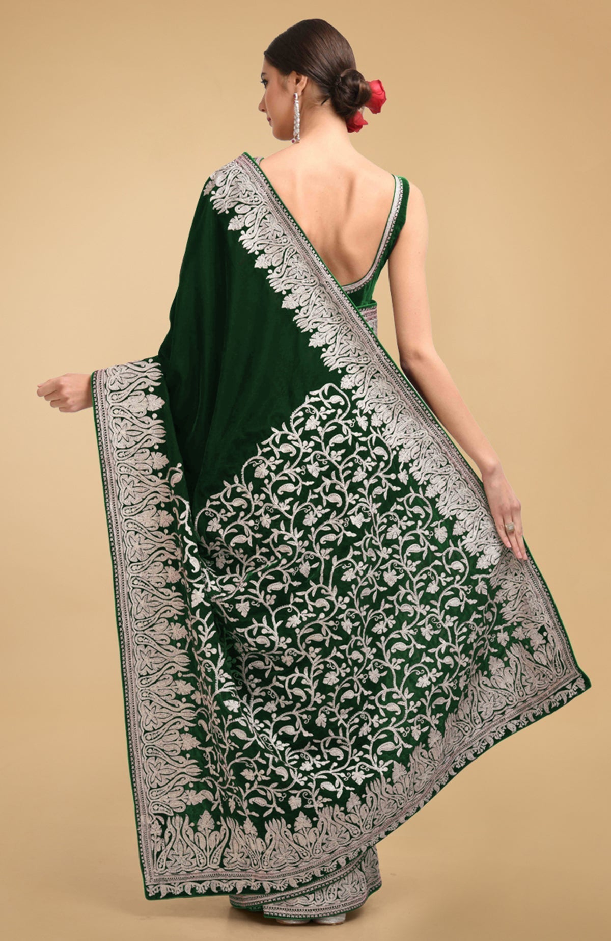 Bottle green velvet saree with silver Kashmiri tilla aari embroidery on borders and pallav.