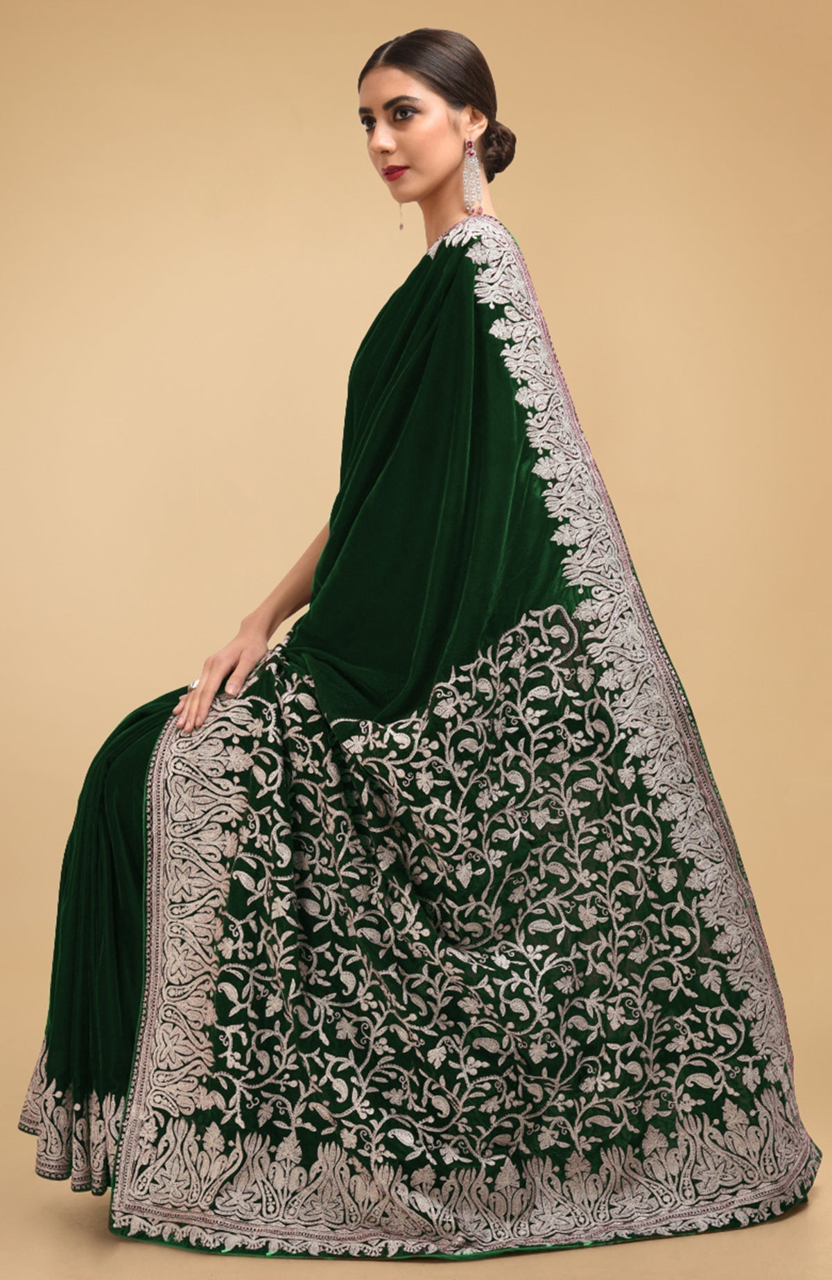 Bottle green velvet saree with silver Kashmiri tilla aari embroidery on borders and pallav.