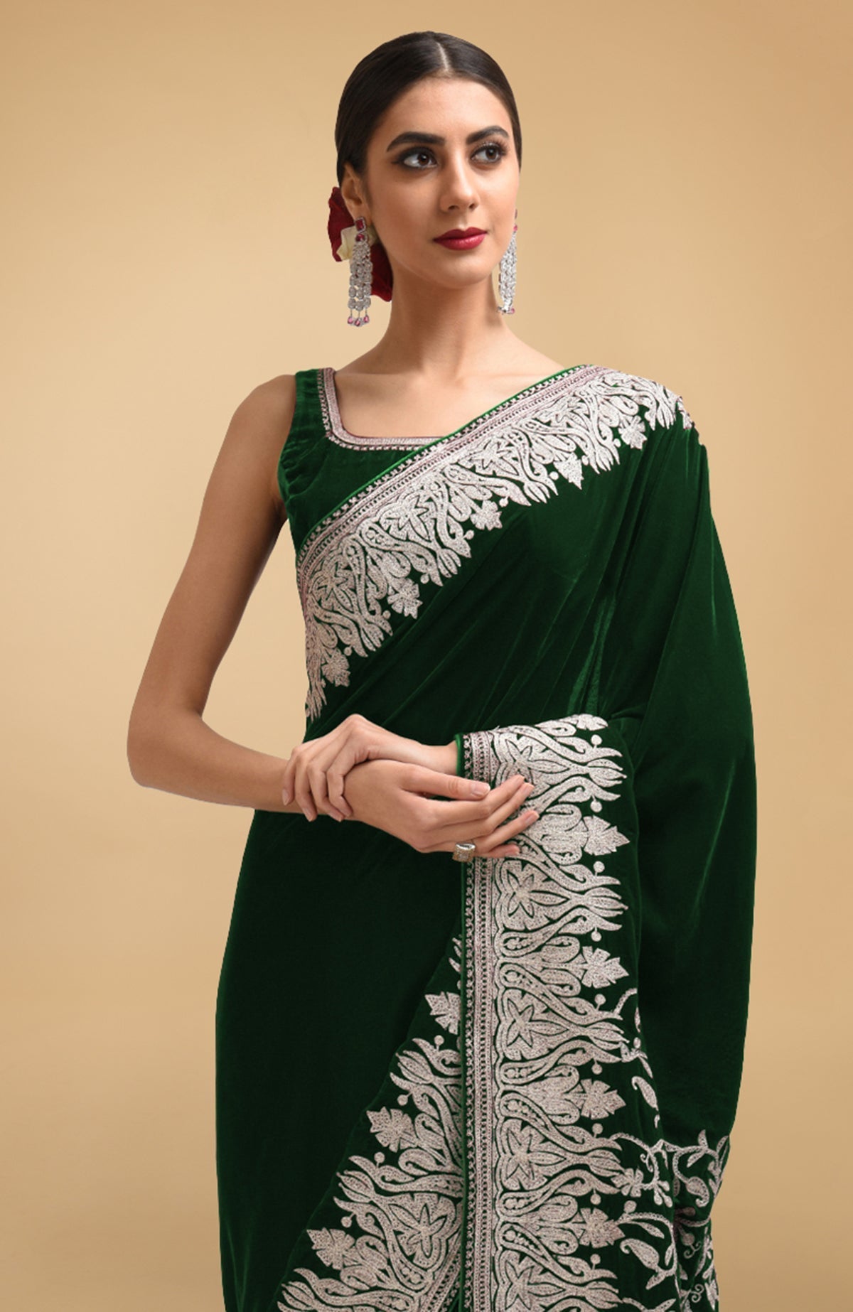 Bottle green velvet saree with silver Kashmiri tilla aari embroidery on border and pallav.