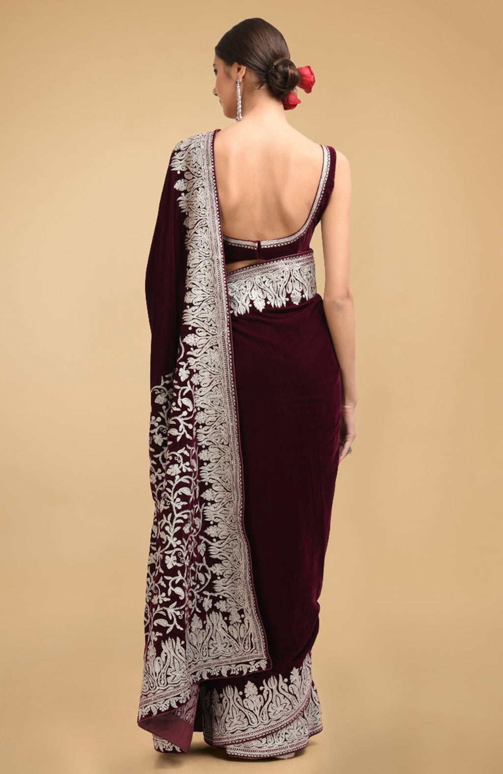 Plum velvet saree with silver tilla aari embroidery on the pallav and borders.