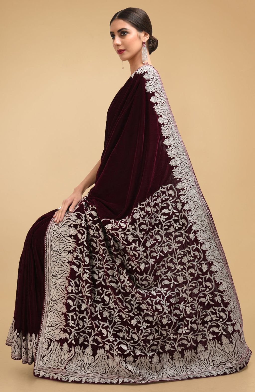 Plum velvet saree with silver tilla aari embroidery on the pallav and borders.