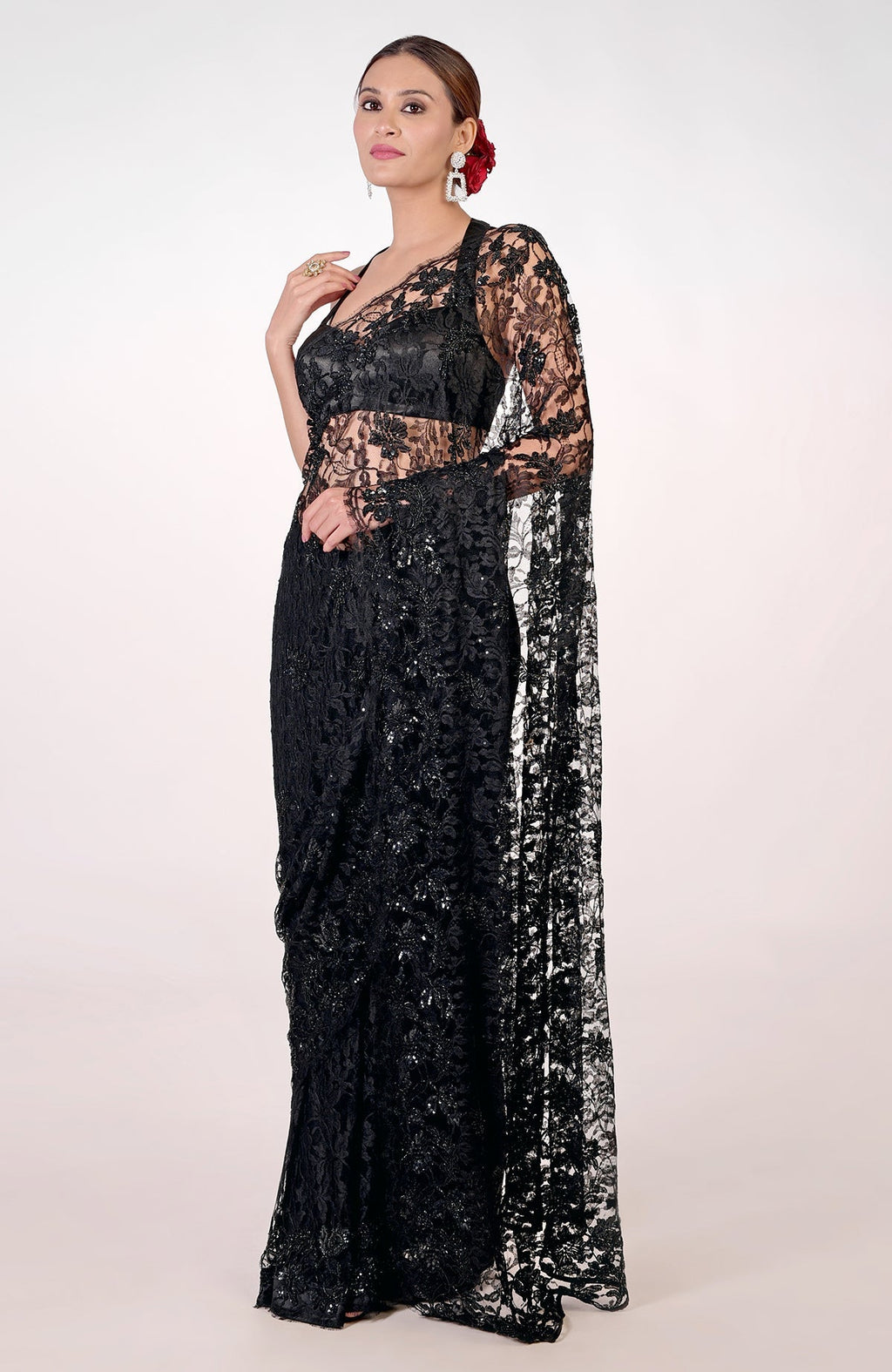 Black French Chantilly lace saree with hand-embroidered sequins, cut beads, and crystals.