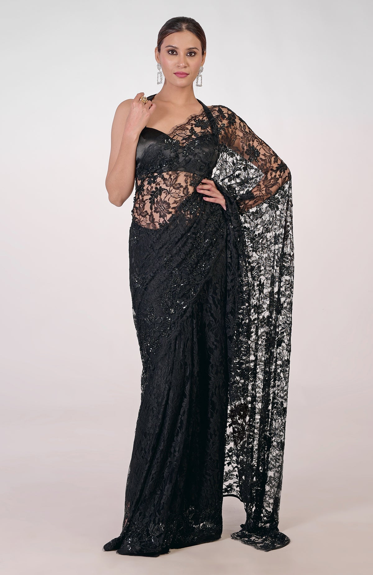 Black French Chantilly lace saree with hand-embroidered sequins, cut beads, and crystals.