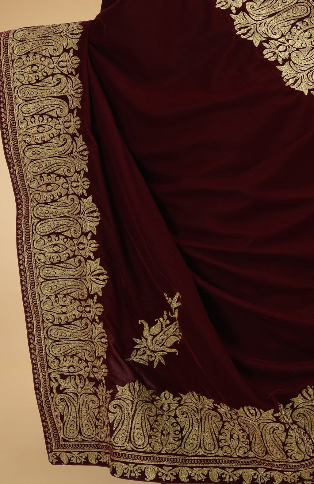 Burgundy velvet saree with gold tilla aari embroidery on the borders and pallav.