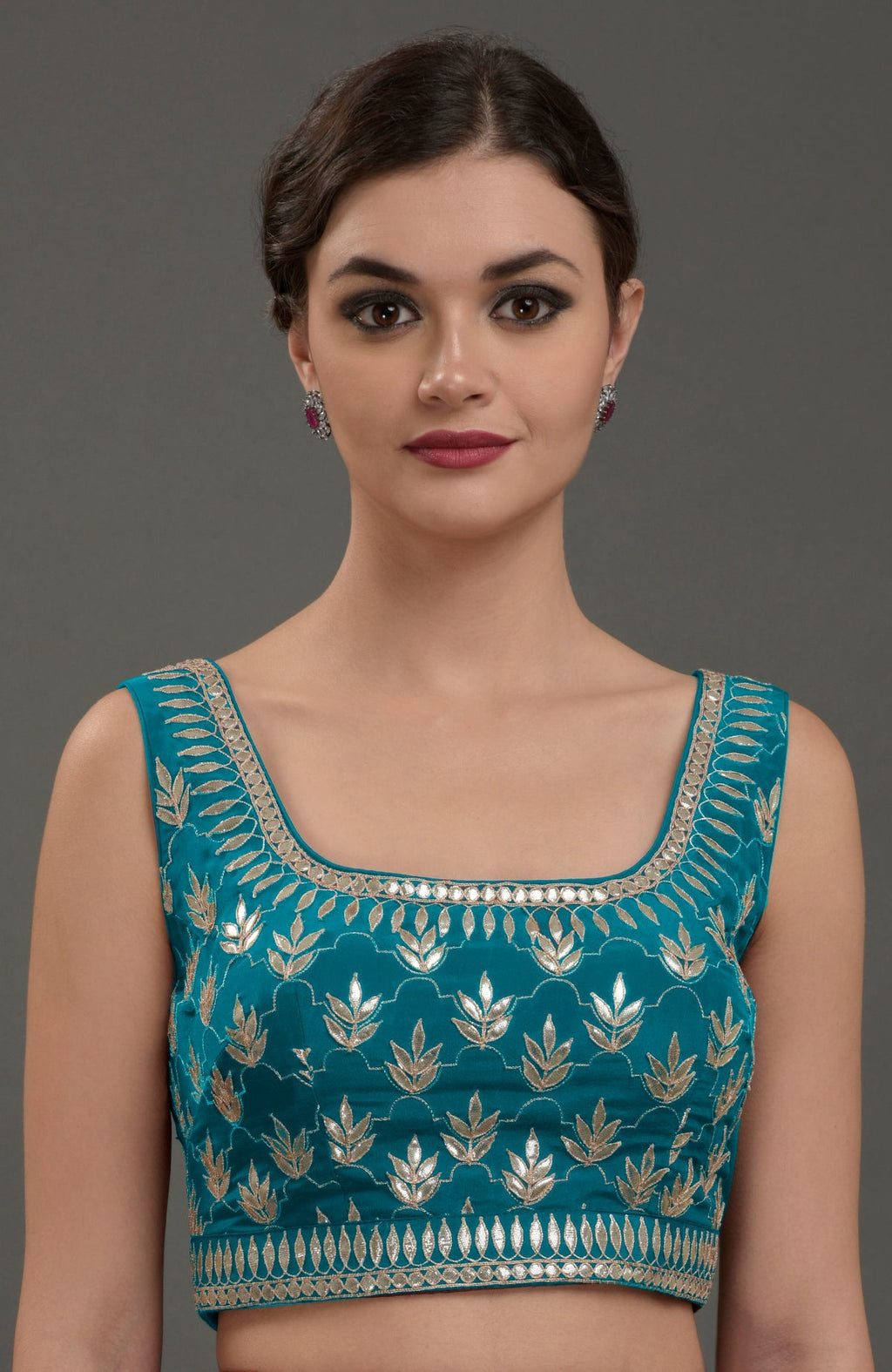 Oceanside blue hand embroidered gota patti blouse with a U-shaped neckline.