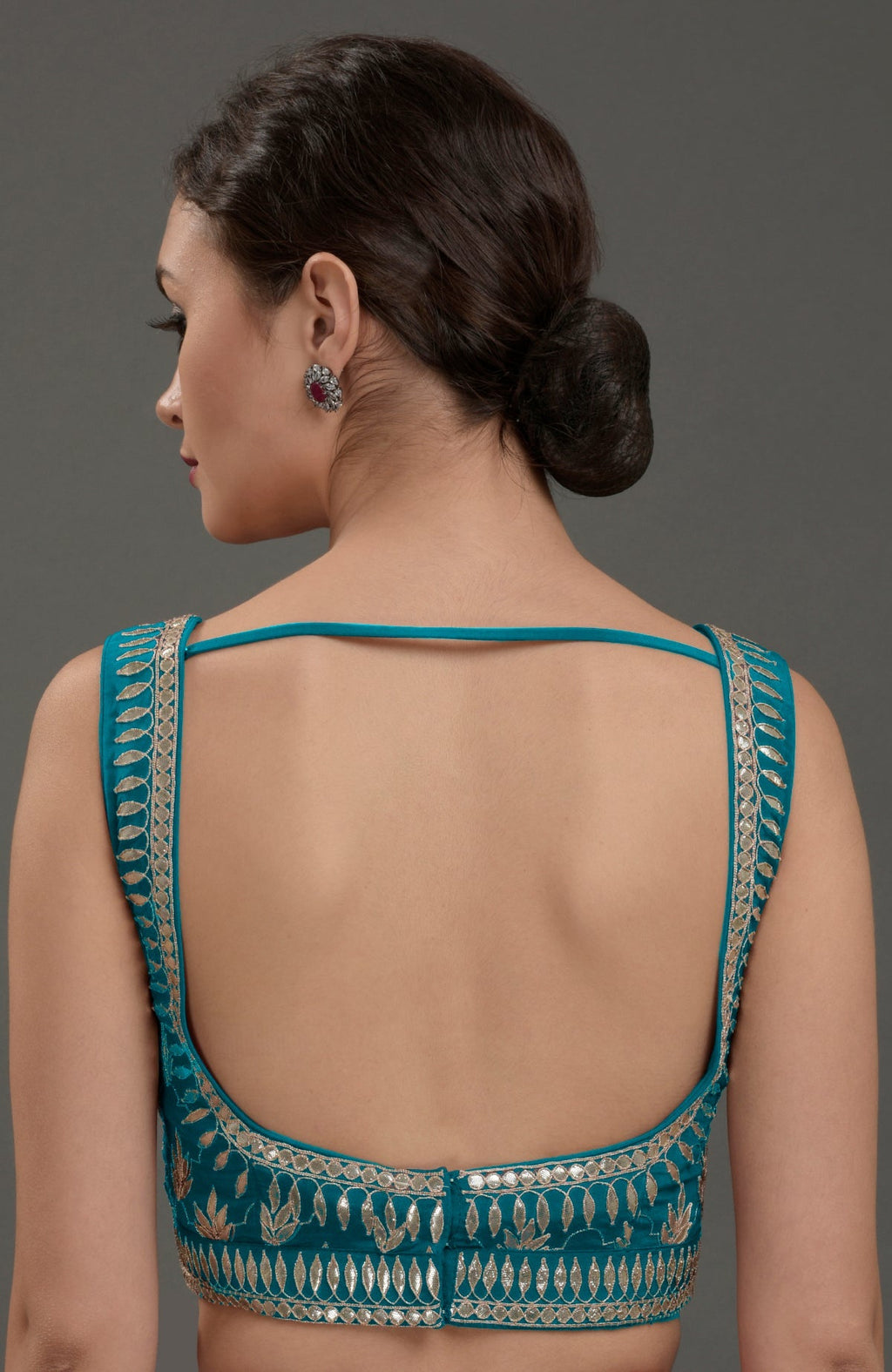 Oceanside blue hand-embroidered gota patti blouse with a deep back and thin straps.