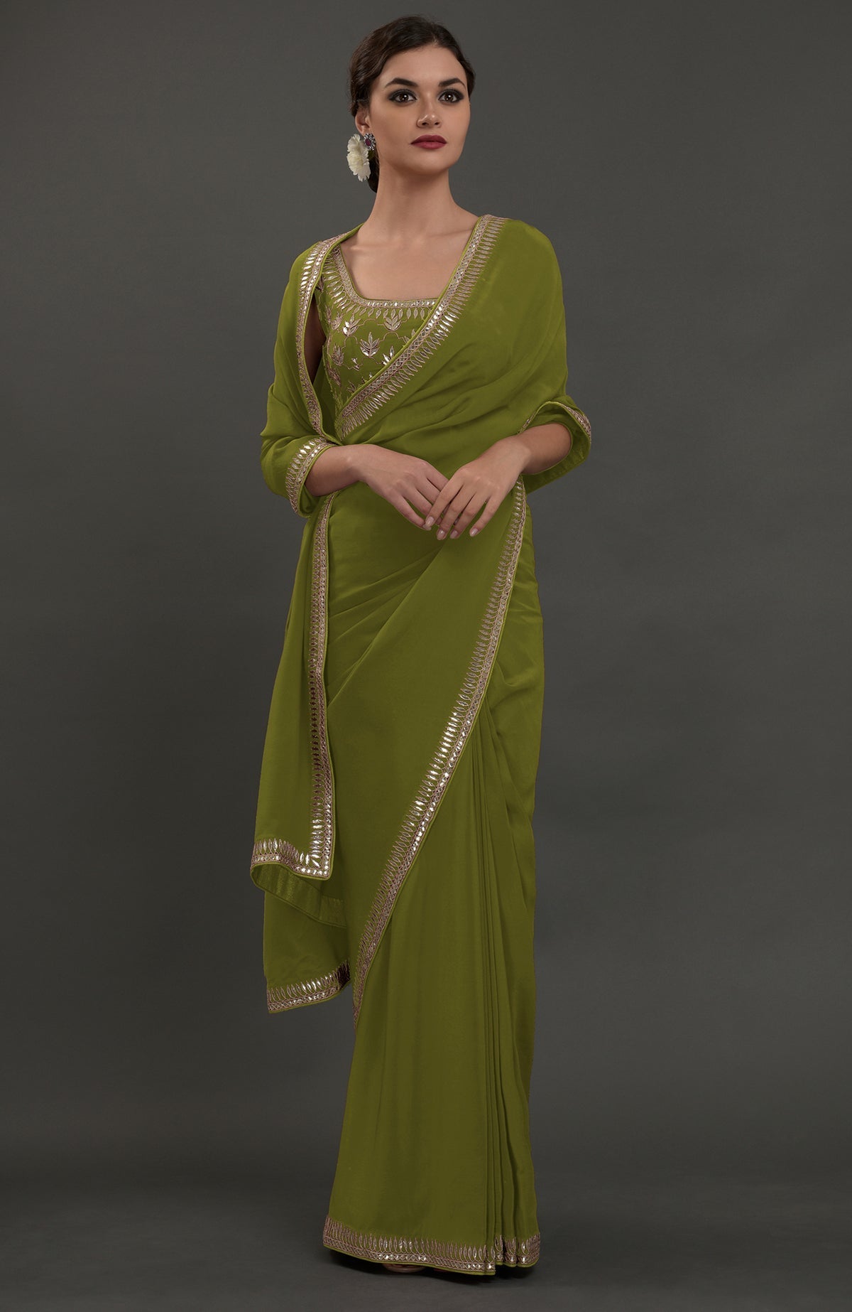 Avocado green embroidered Gota Patti saree with matching blouse.