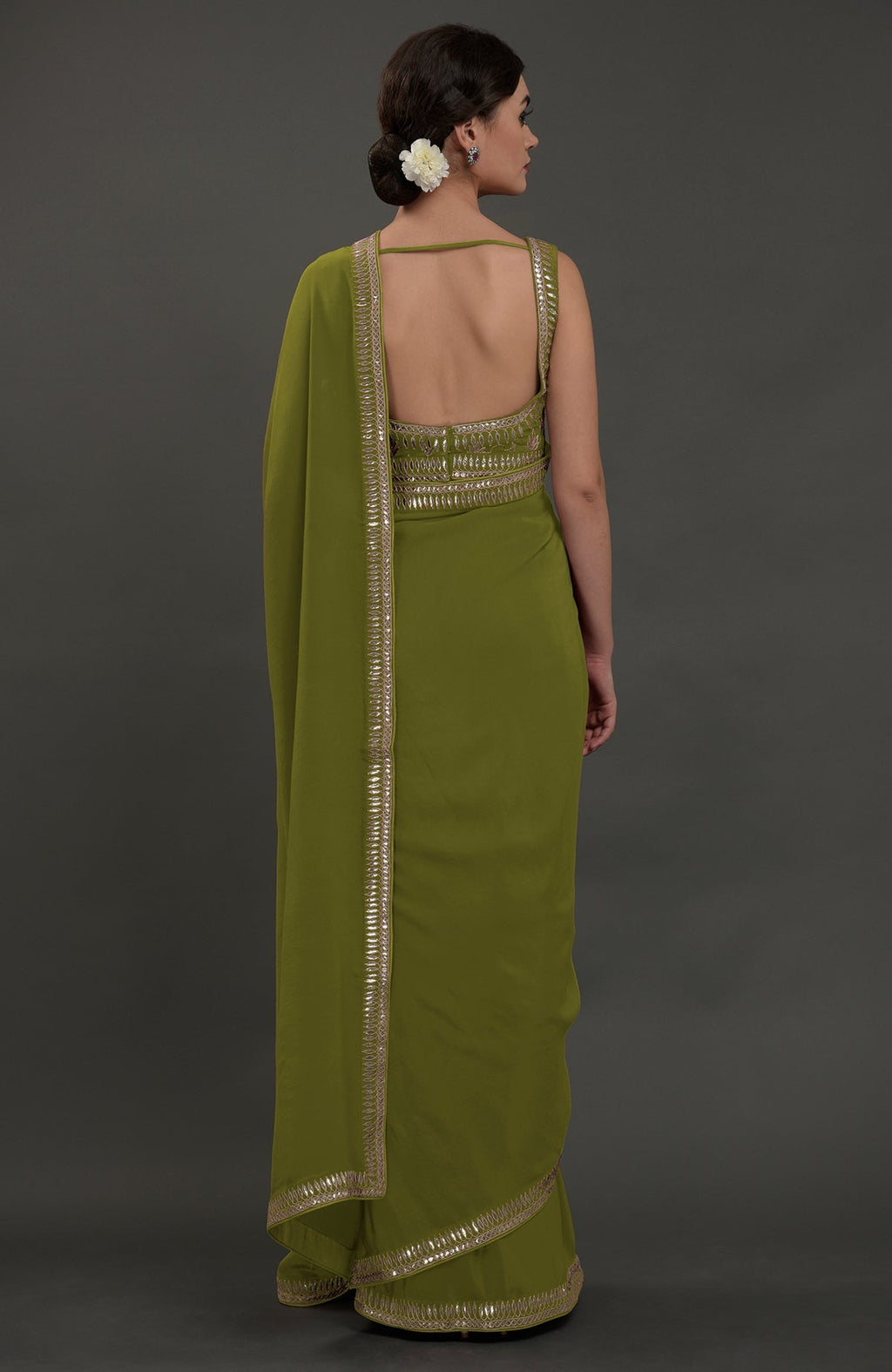 Avocado green embroidered gota patti saree with a deep back blouse.