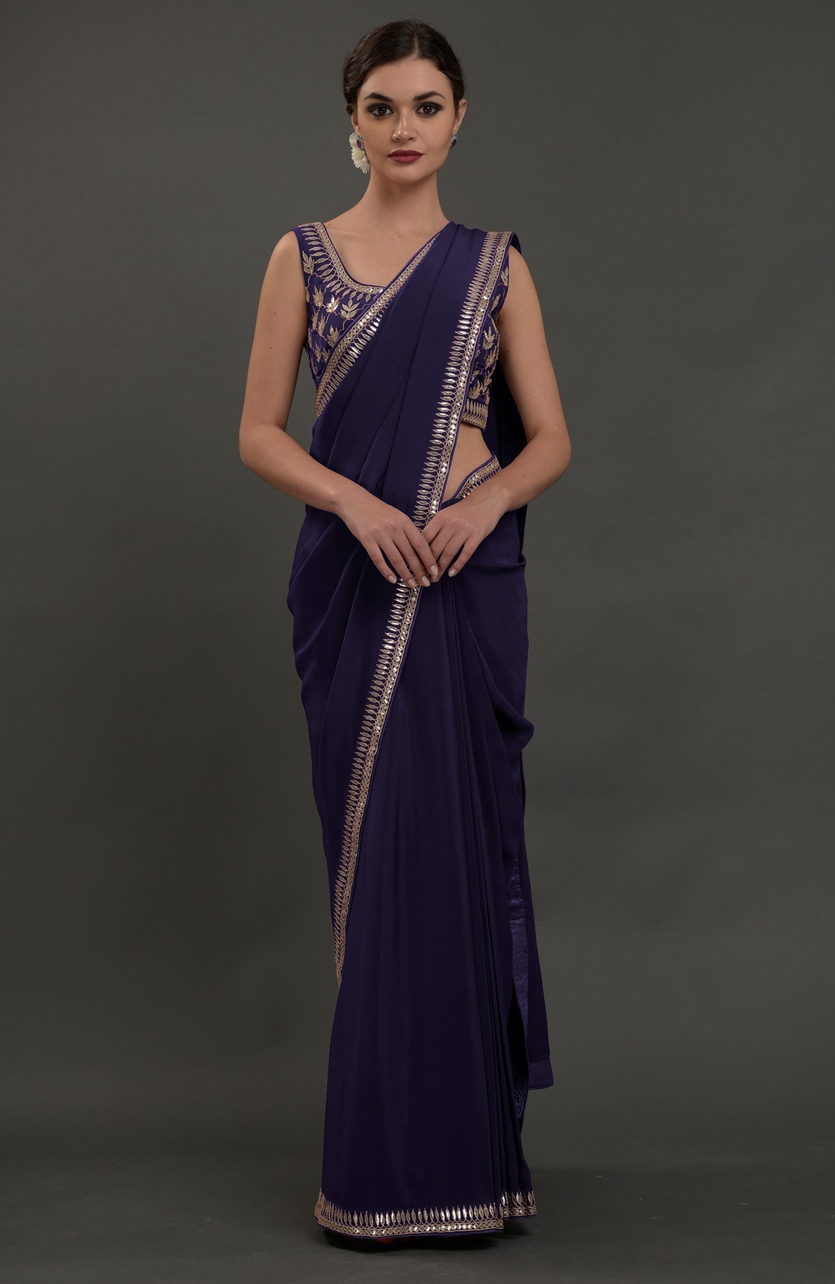 Oceanside blue crepe saree with silvery gold gota patti embroidery and matching blouse.