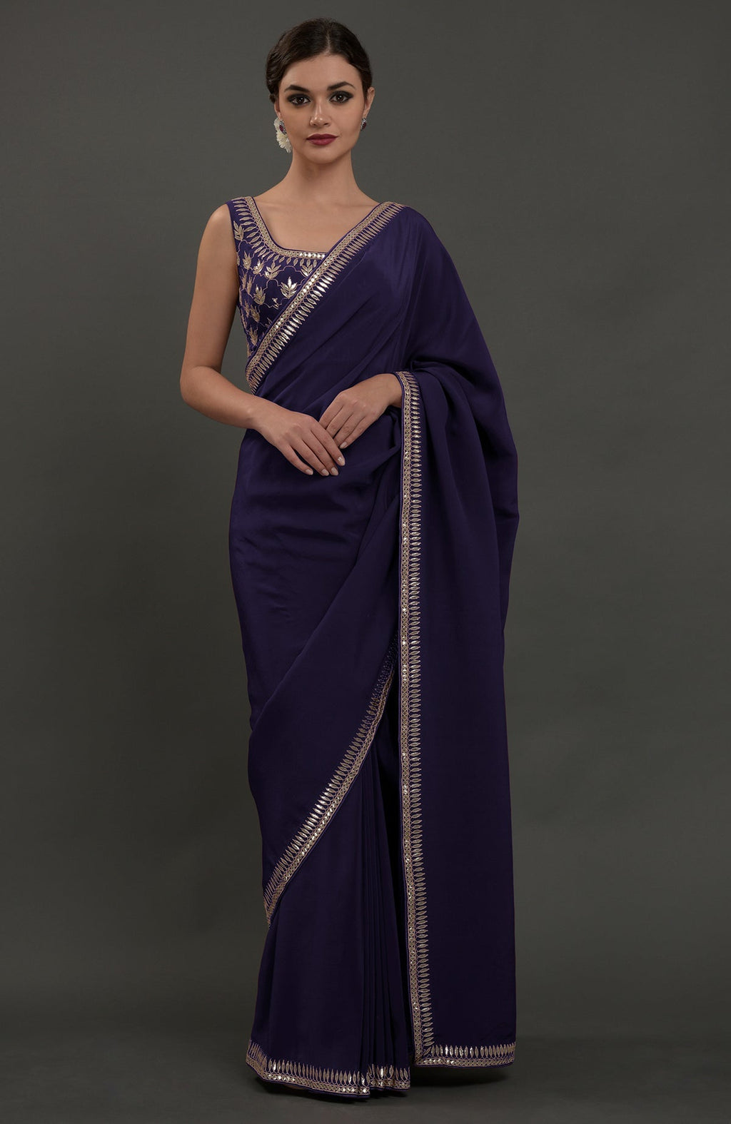Eclipse blue crepe saree with silvery gold gota patti embroidery on borders and blouse.