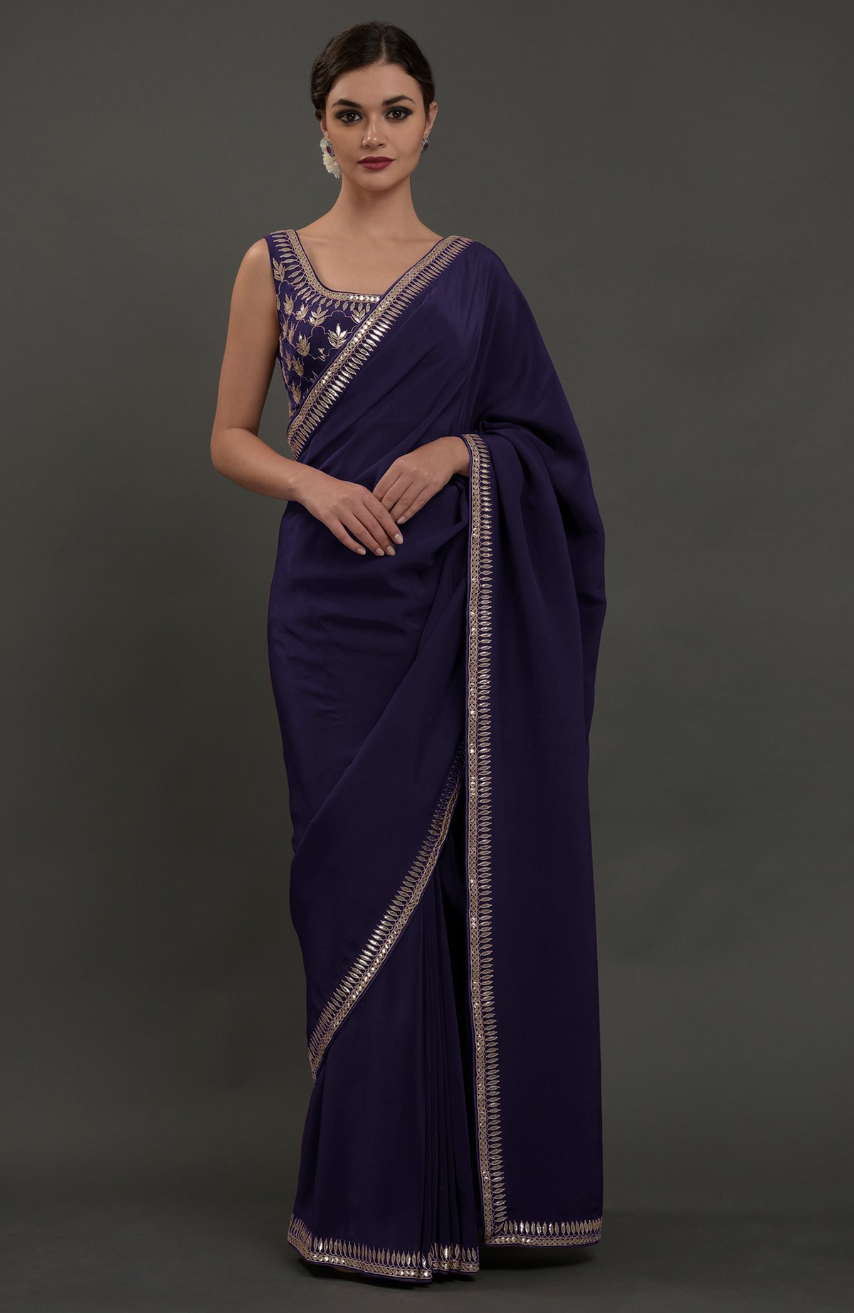 Eclipse blue crepe saree with silvery gold gota patti embroidery on borders and blouse.