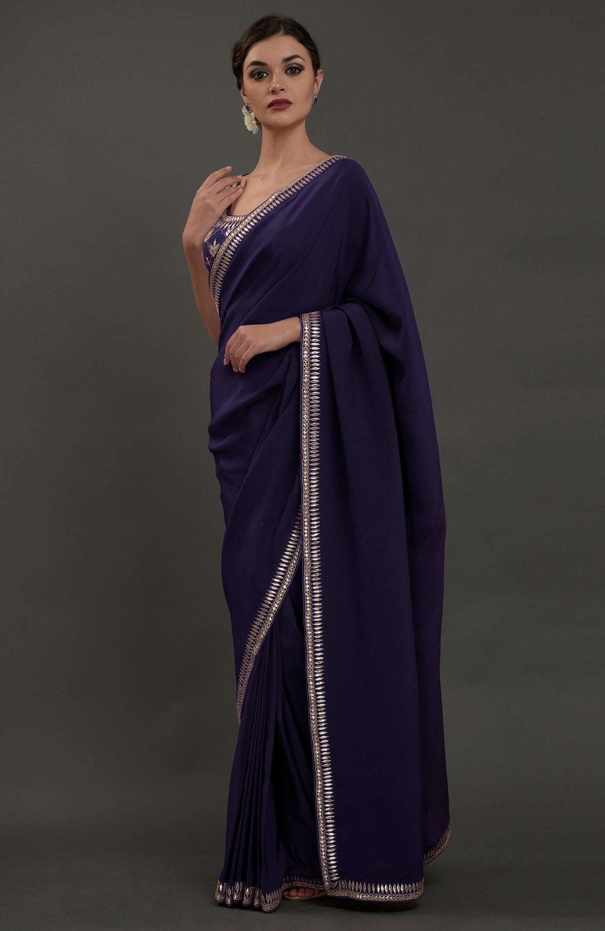 Eclipse blue crepe saree with intricate silvery gold gota patti embroidery.