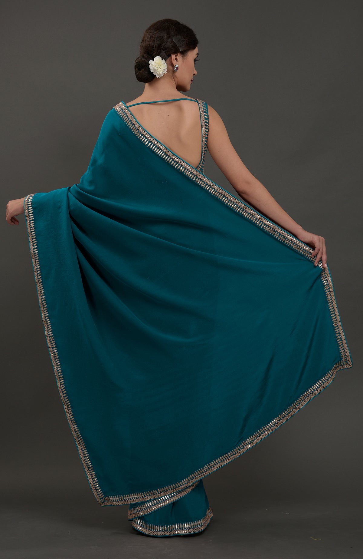 Oceanside blue embroidered gota patti saree with a deep back blouse.