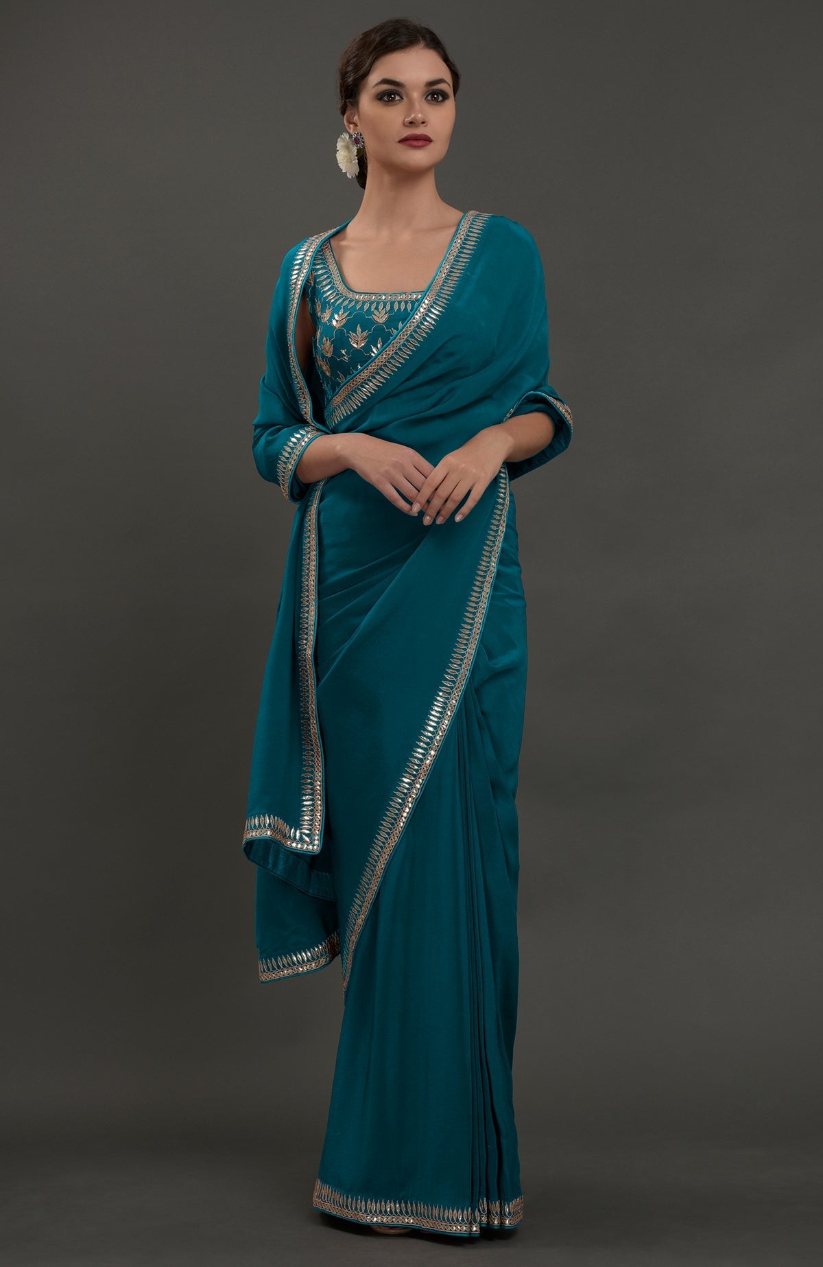 Oceanside blue embroidered gota patti saree with a matching blouse.