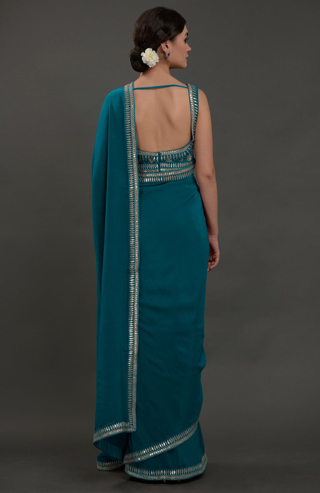 Oceanside blue embroidered gota patti saree with a deep back blouse.