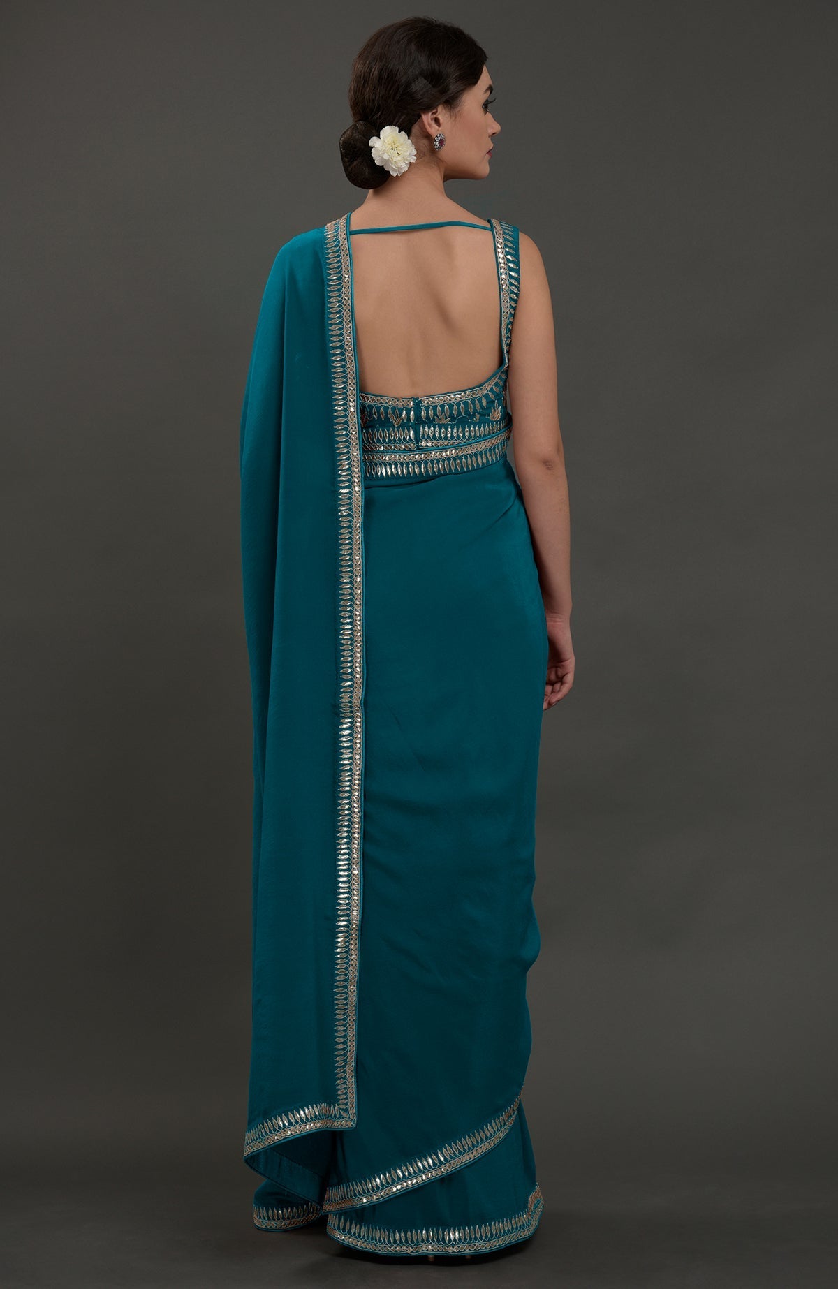 Oceanside blue embroidered gota patti saree with a deep back blouse.