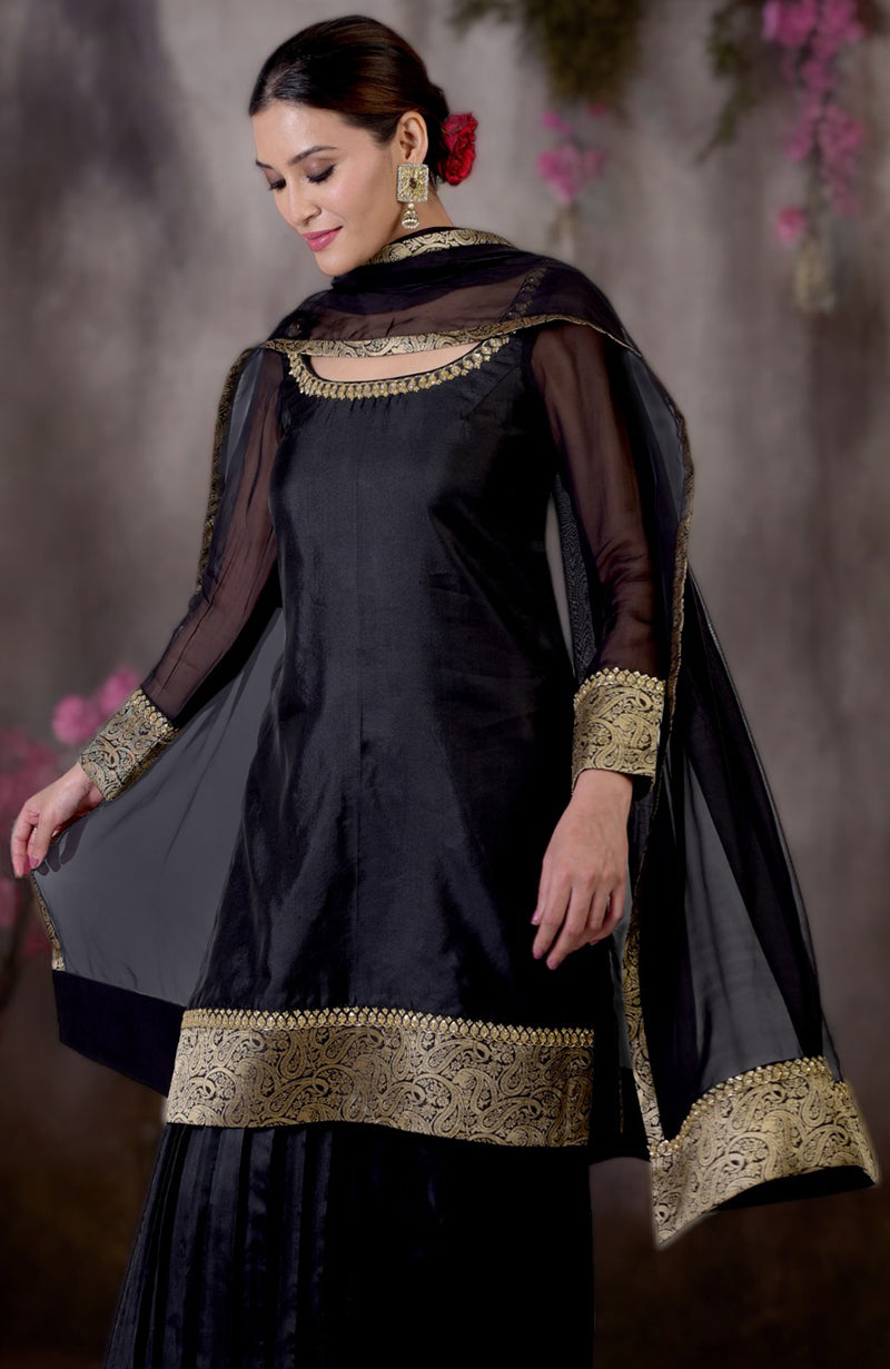 Black-gold Banarasi embroidered sharara set with a sheer dupatta.