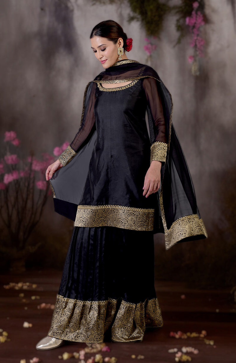Black-gold Banarasi embroidered sharara set with a sheer dupatta.