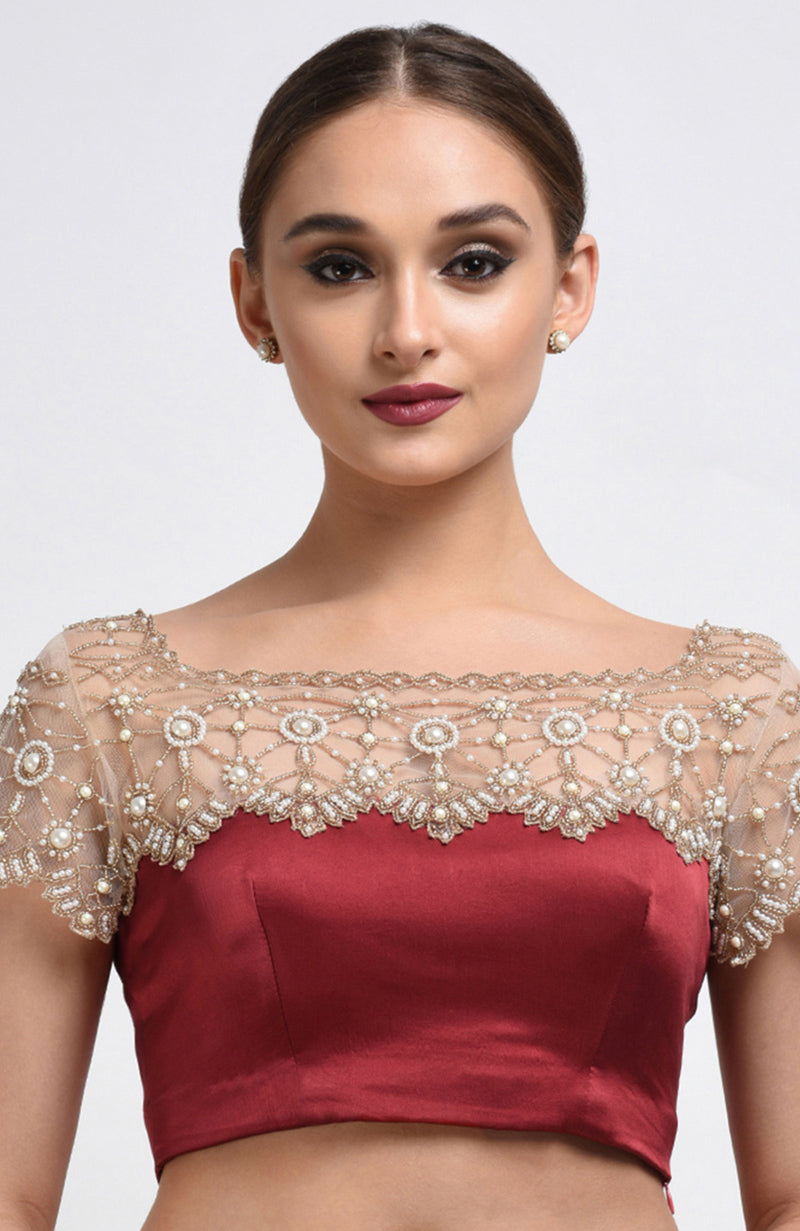 Maroon satin silk blouse with pearl hand-embroidered nude net yoke and sleeves.
