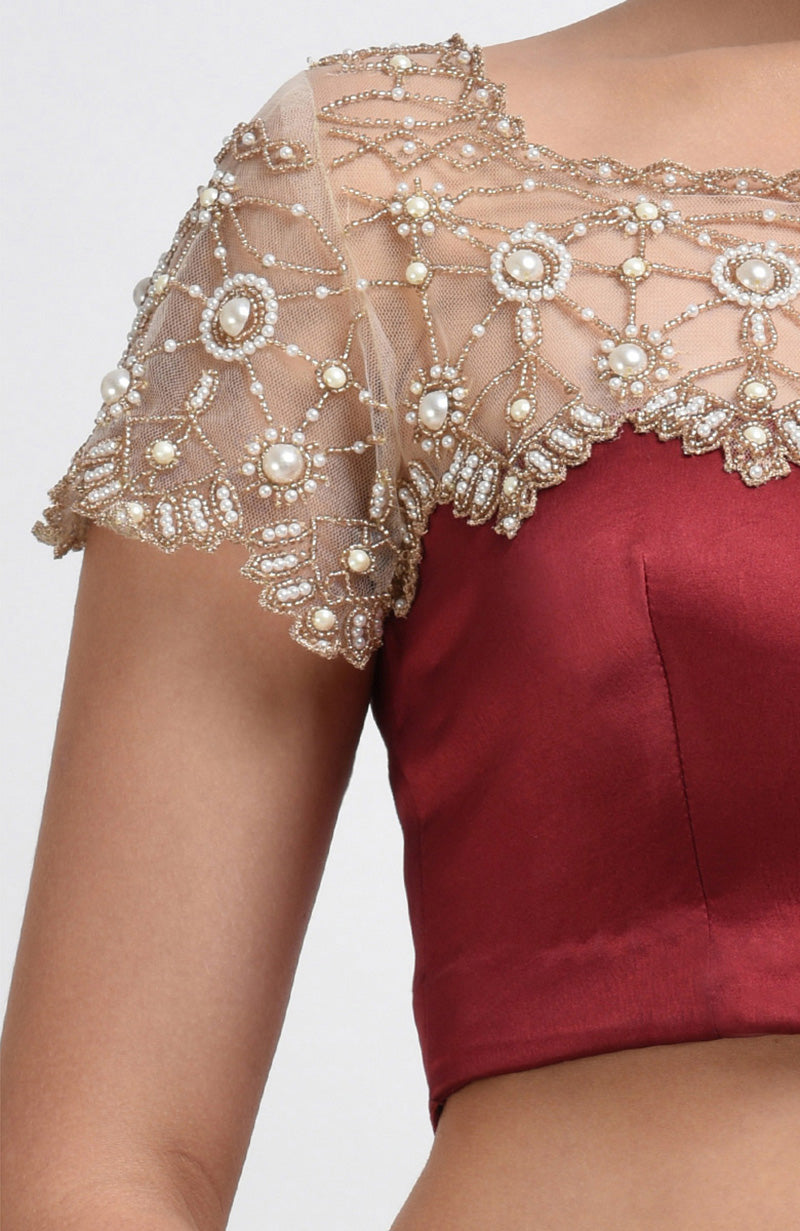 Maroon pure satin silk blouse with pearl hand-embroidered nude net yoke and sleeves.