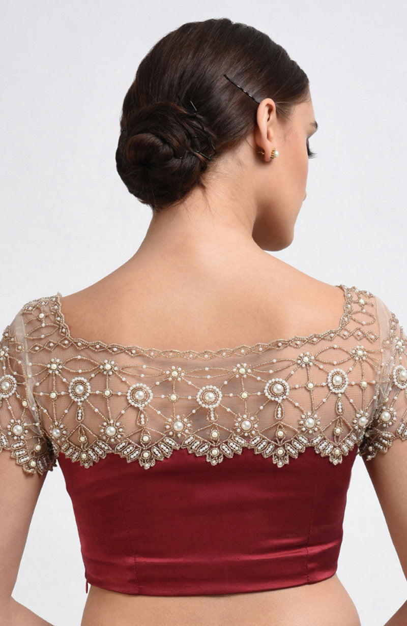 Maroon satin silk blouse with pearl hand-embroidered nude net yoke and sleeves.