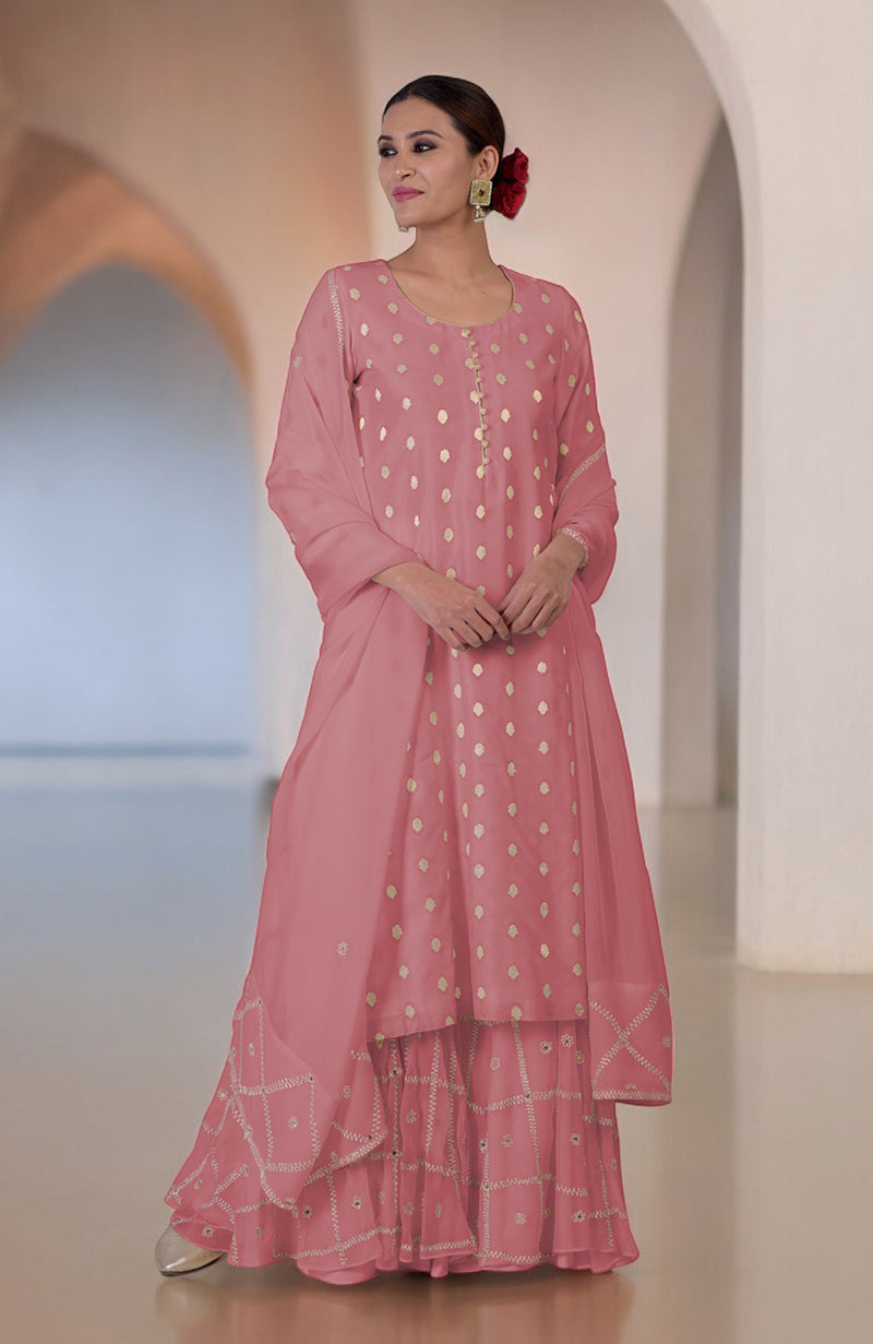 A woman models a withered rose Banarasi bootah and Aari tilla embroidered sharara set.