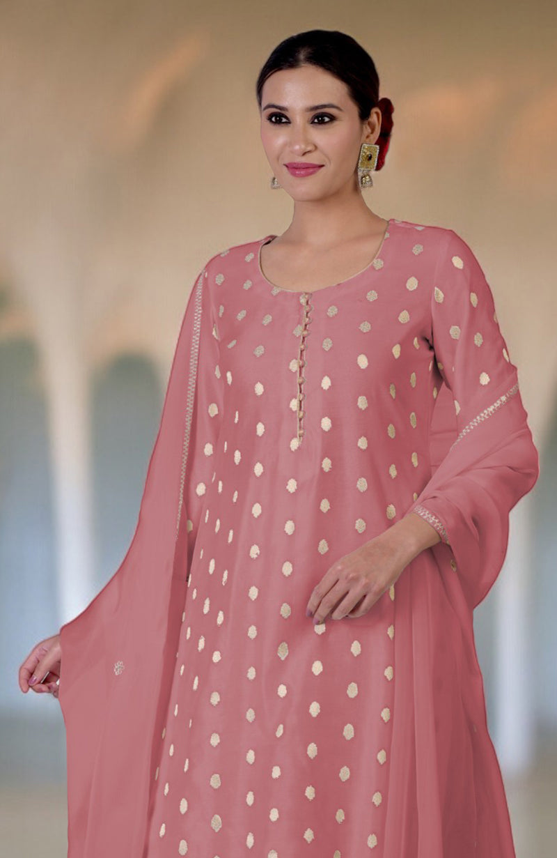 Woman in a withered rose Banarasi bootah and aari tilla embroidered sharara set.
