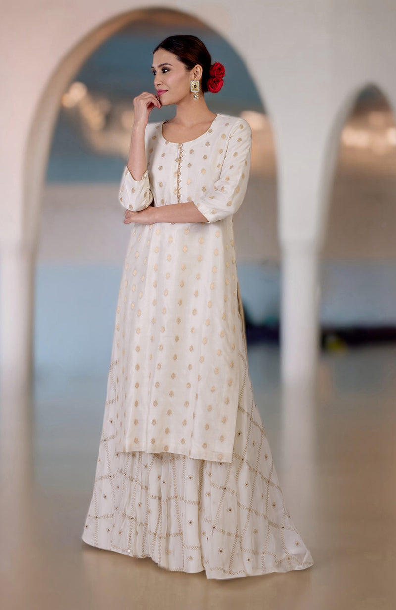 Ivory Banarasi kurta with gold bootah and aari tilla embroidered sharara set.