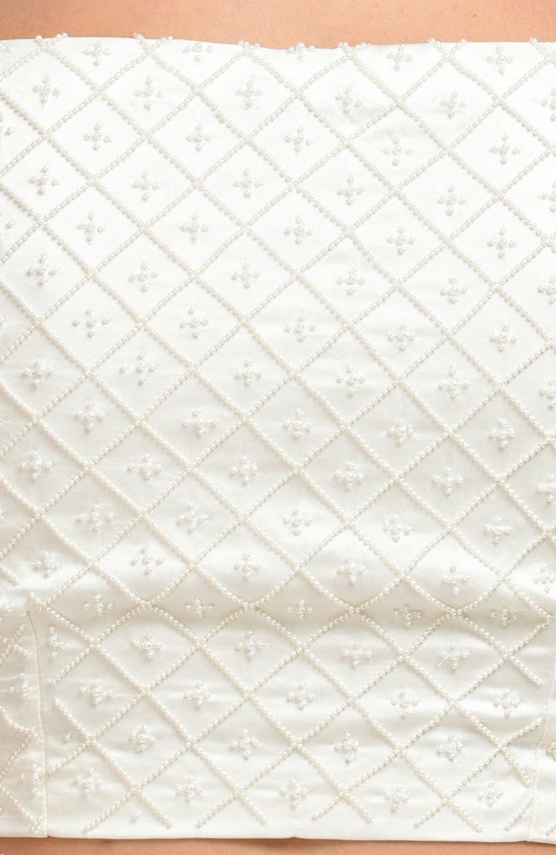 Ivory pearl beaded hand embroidered blouse with a lattice pattern.