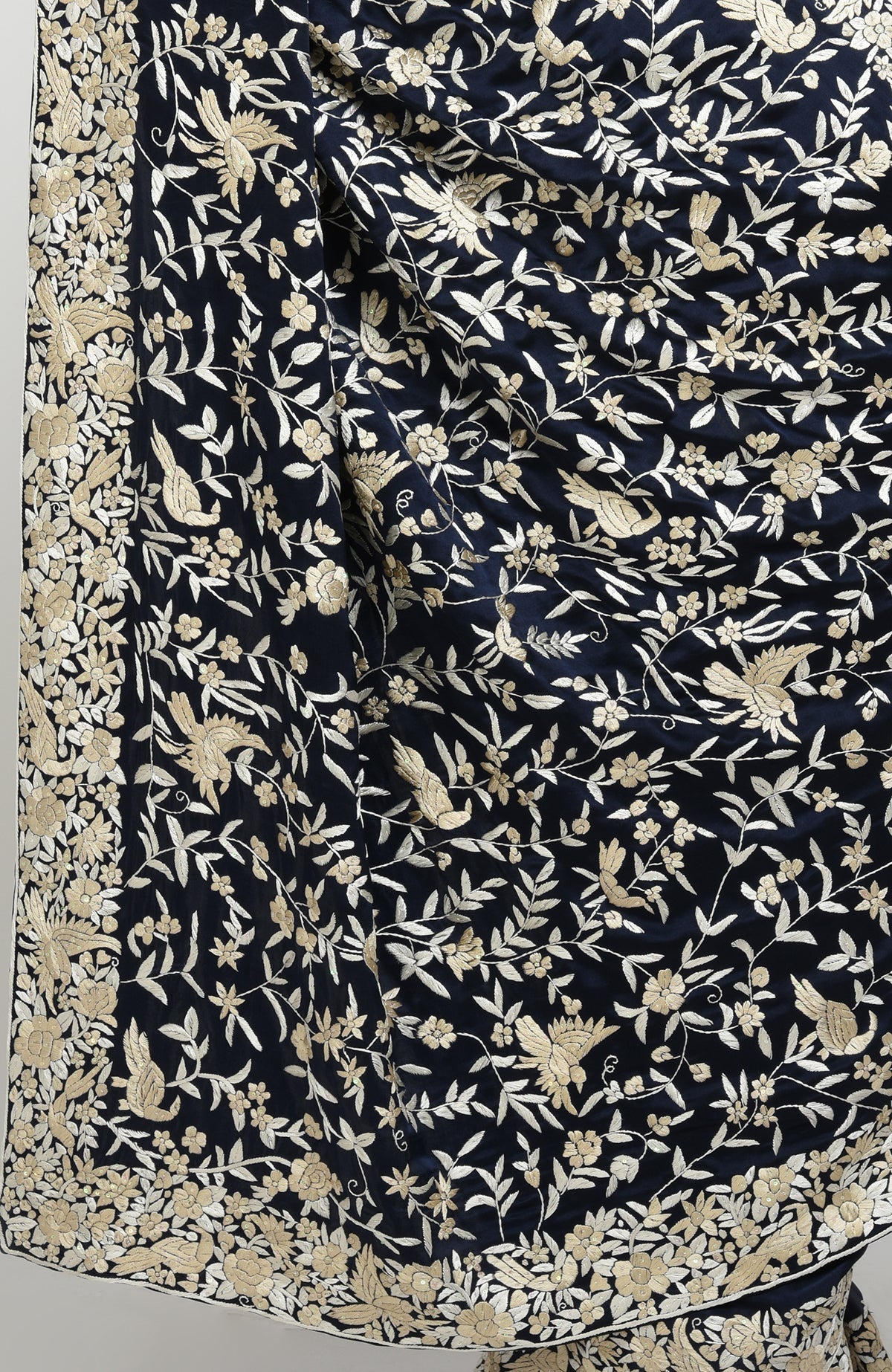 Navy blue Parsi Gara hand-embroidered pure satin silk saree with beige floral-bird motifs.
