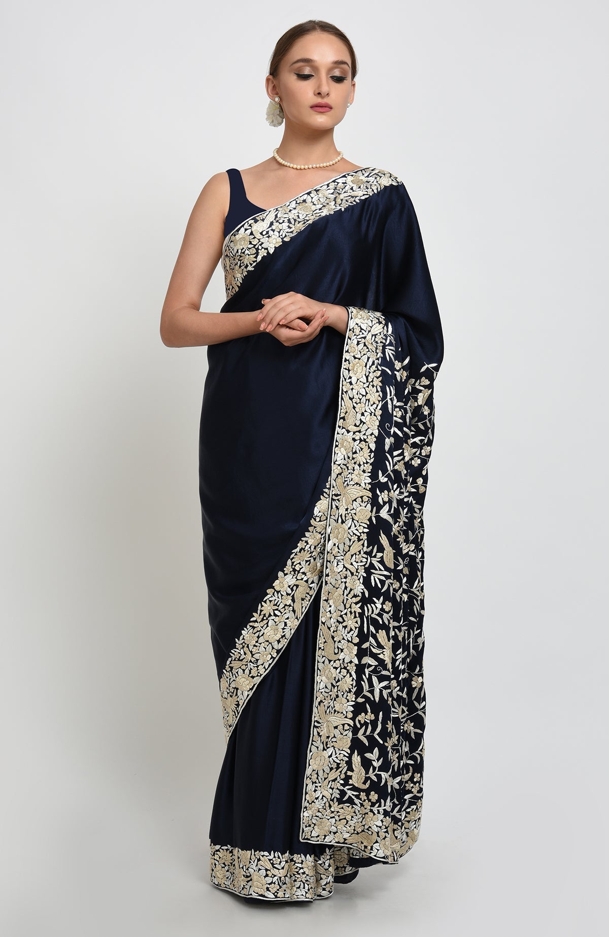Navy blue Parsi Gara hand embroidered saree with beige floral and bird motifs.